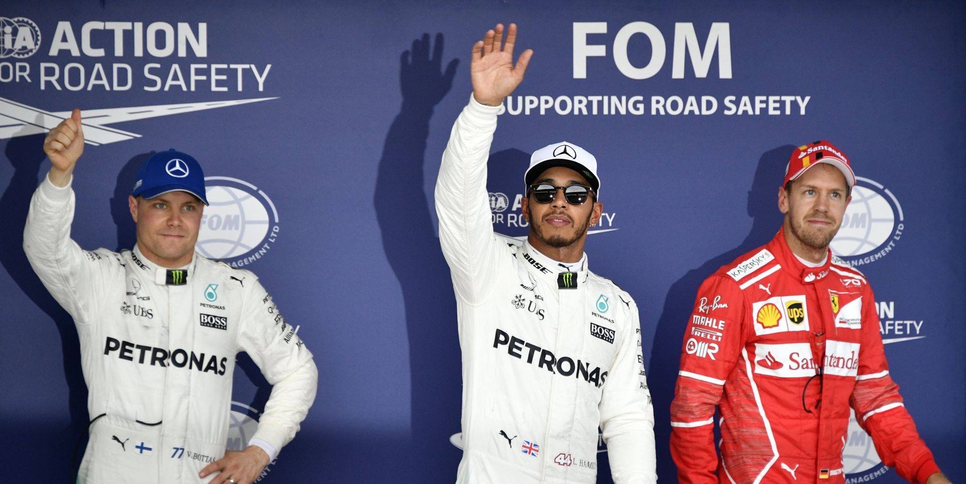 epa06249665 British Formula One driver Lewis Hamilton (C) of Mercedes AMG GP, his teammate Finnish Formula One driver Valtteri Bottas (L) pose with German Formula One driver Sebastian Vettel of Scuderia Ferrari after the qualifying session of the Japanese Formula One Grand Prix at the Suzuka Circuit in Suzuka, central Japan, 07 October 2017. Hamilton took the pole position, Bottas finished second and Vettel third. The Japanese Formula One Grand Prix will take place on 08 October.  EPA/FRANCK ROBICHON