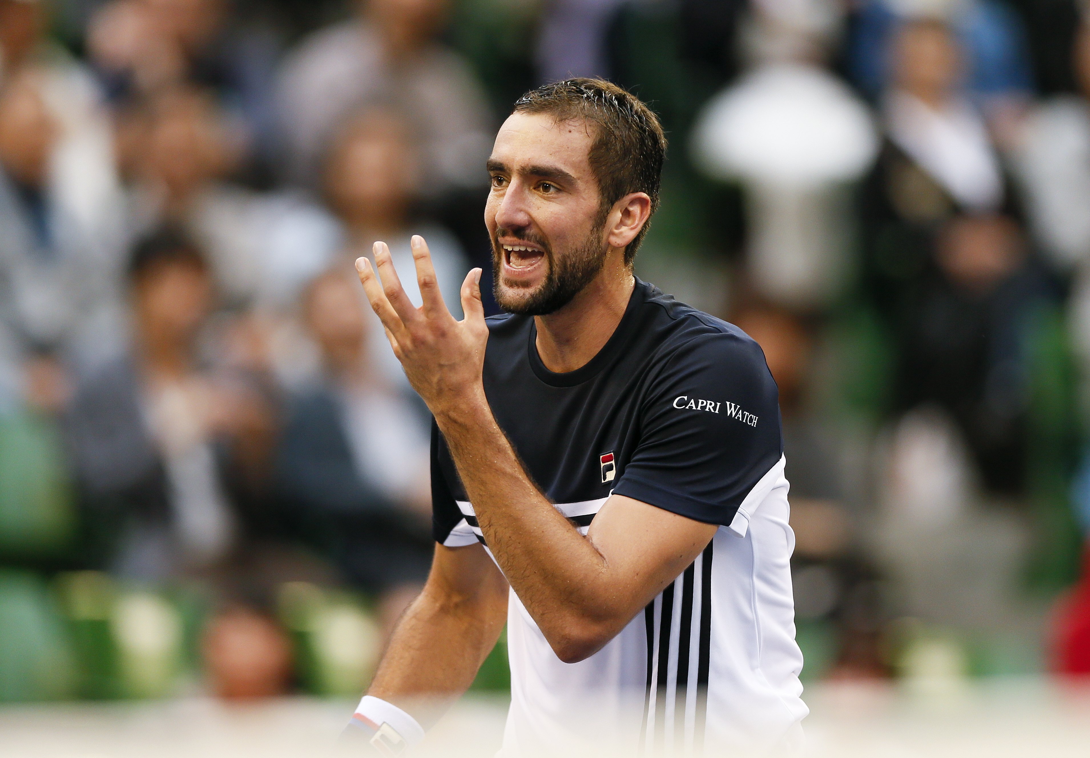 epa06249832 Marin Cilic of Croatia reacts after missing a shot against Adrian Mannarino of France during the semifinals of Japan Open tennis championships in Tokyo, Japan, 05 October 2017.  EPA/KIMIMASA MAYAMA