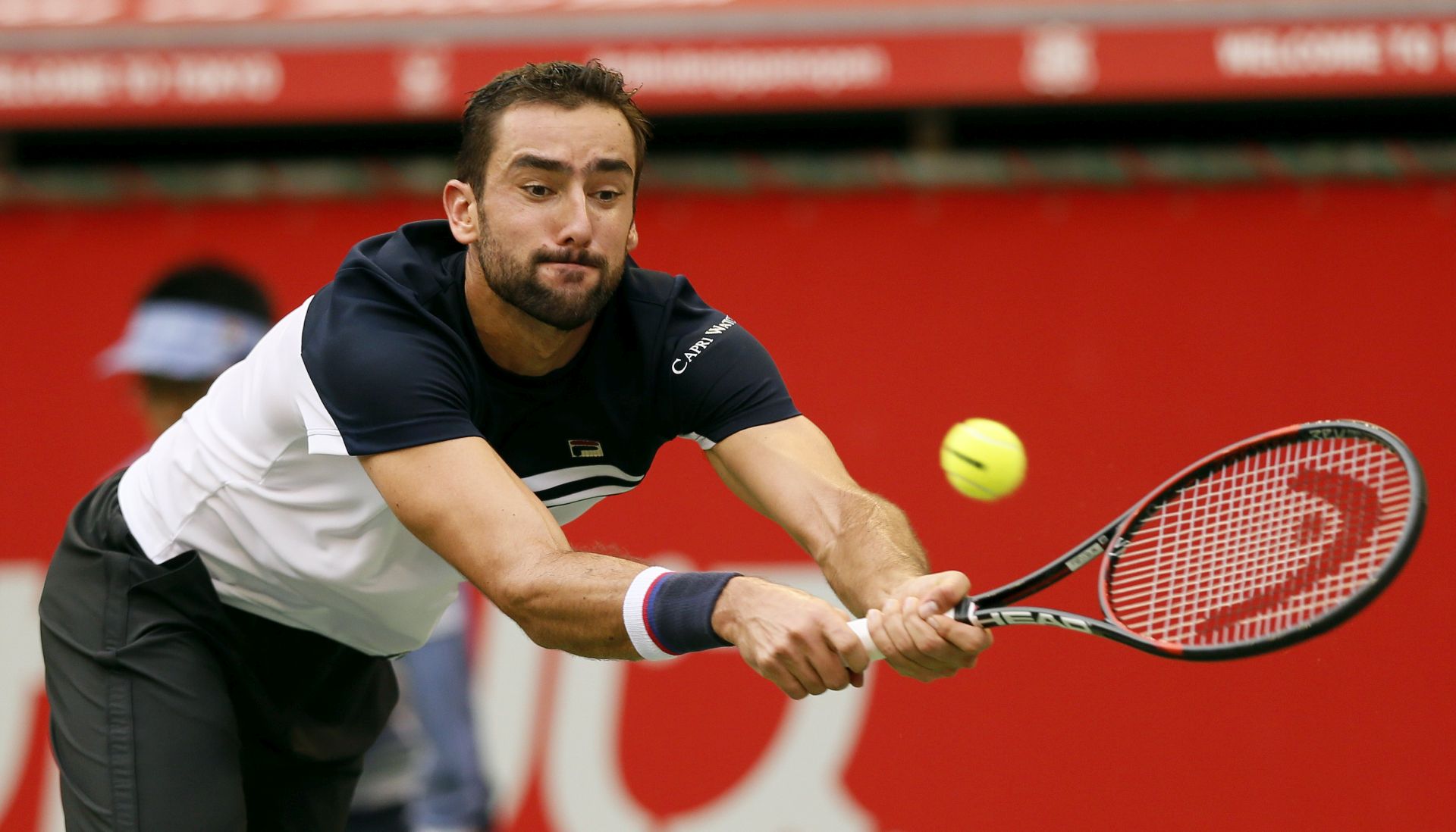 epa06249831 Marin Cilic of Croatia returns a backhand shot against Adrian Mannarino of France during the semifinals of Japan Open tennis championships in Tokyo, Japan, 05 October 2017.  EPA/KIMIMASA MAYAMA