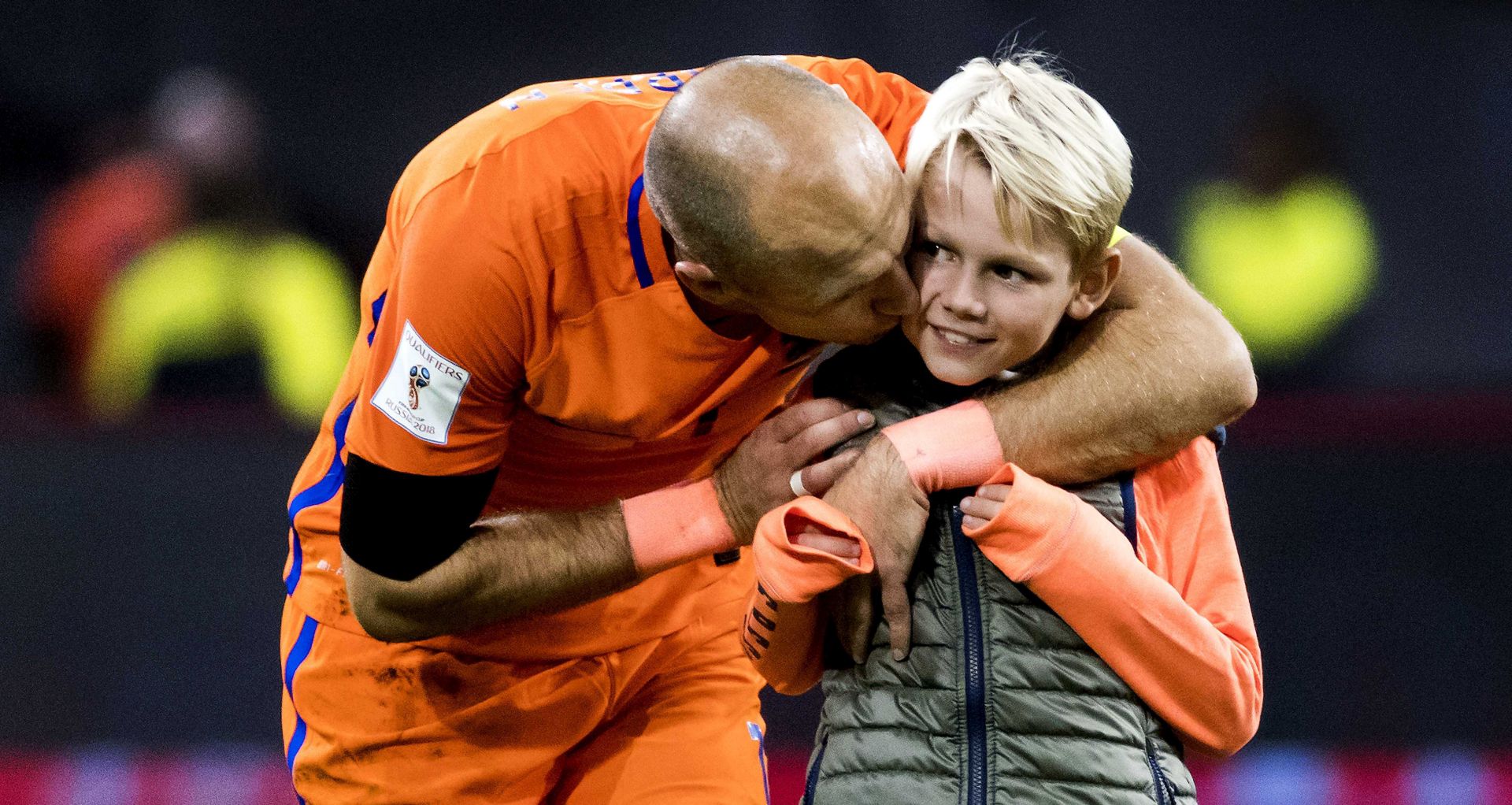 epa06257828 Dutch national soccer player Arjen Robben (L) kisses his son after the FIFA World Cup 2018 qualifying Group A soccer match between Netherlands and Sweden, in Amsterdam, The Netherlands, 10 October 2017.  EPA/Koen van Weel