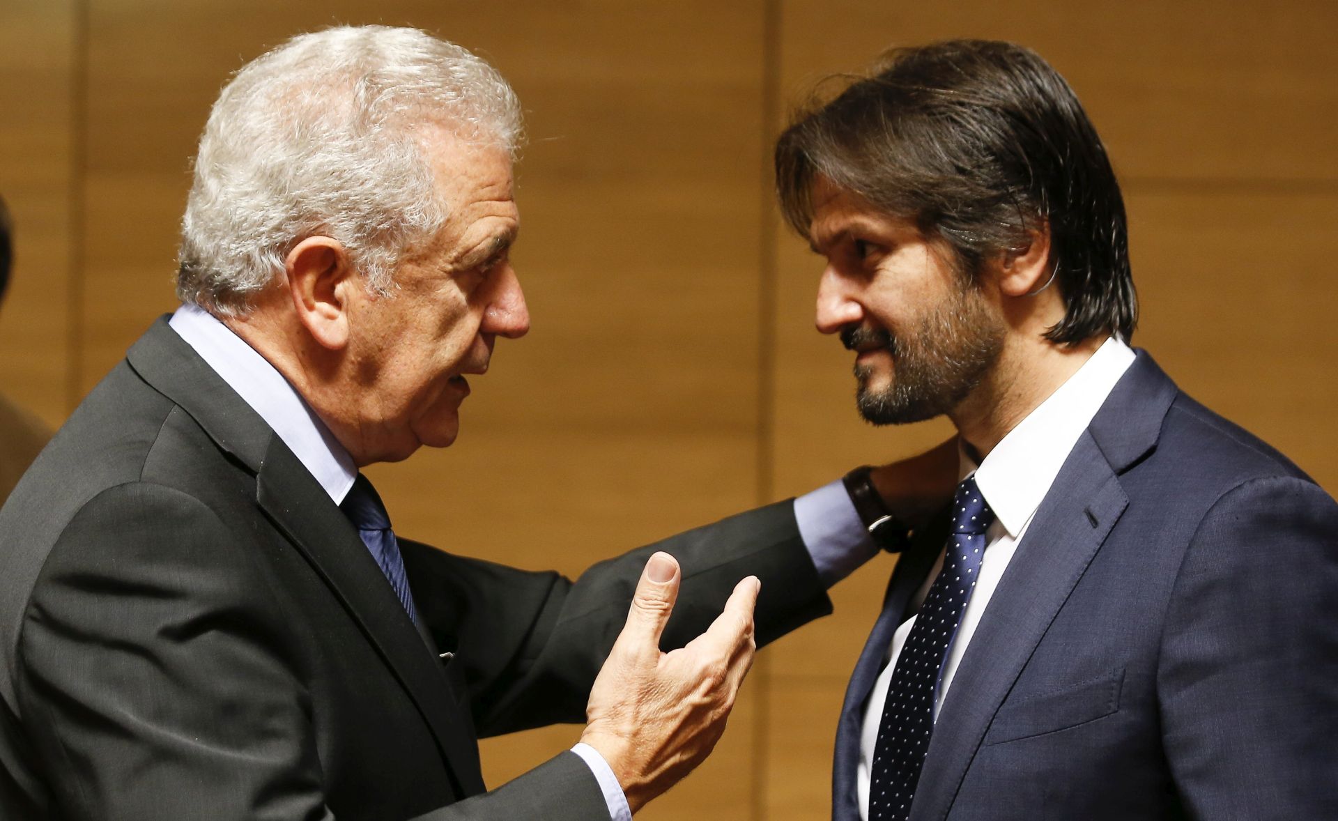 epa06262851 EU Commissioner for Migration, Home Affairs and Citizenship, Dimitris Avramopoulos (L) chats with Slovak Interior Minister Robert Kalinak (R) at the start of the Joint Justice and Home Affairs Council meeting in Luxembourg, 13 October 2017.  There will be a Proposal for a regulation amending the Schengen Borders code.  EPA/JULIEN WARNAND