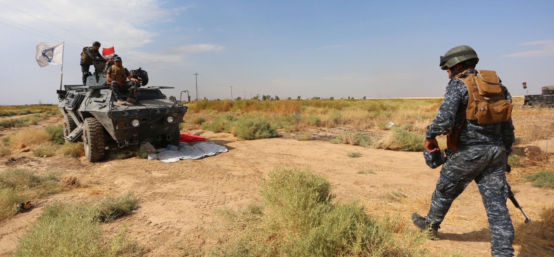 epa06263557 Iraqi federal police forces take up position in Rashad town, southern Kirkuk, north of Iraq, 13 October 2017.  According to media reports, the Iraqi forces launched an operation to capture the disputed city of Kirkuk and seize Kurdish Peshmerga positions near Kirkuk in al-Bashir and Taza, 27 km south of Kirkuk's giant oil field at Bai Hassan, while Iraq's Joint Command has denied the reports and announced that the operation is a part of security operation to secure the recently recaptured areas around Hawija.  EPA/MURTAJA LATEEF