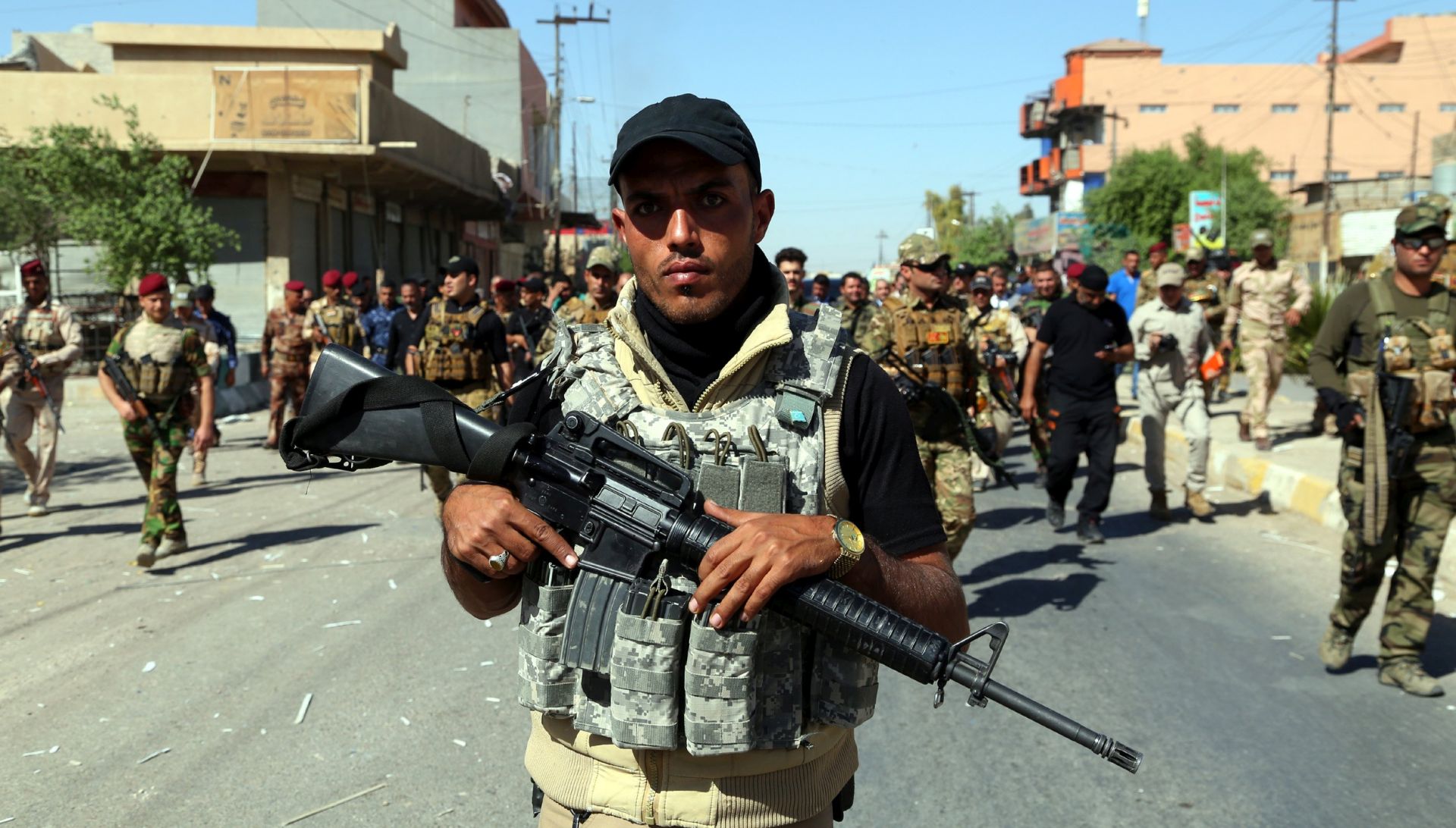epa06272610 Members of Iraqi Shiite group known as Hashd al-Shaabi (The Popular Crowd) patrol an area in Tuz, southern Kirkuk city, Iraq, 17 October 2017 (issued 18 October 2017). Iraqi military forces launched operations against Kurdish forces around Kirkuk early on 16 October 2017, and took control of the largests oil fields in the disputed city after Kurdish forces withdrew.  EPA/BAREQ AL-SAMARRAI