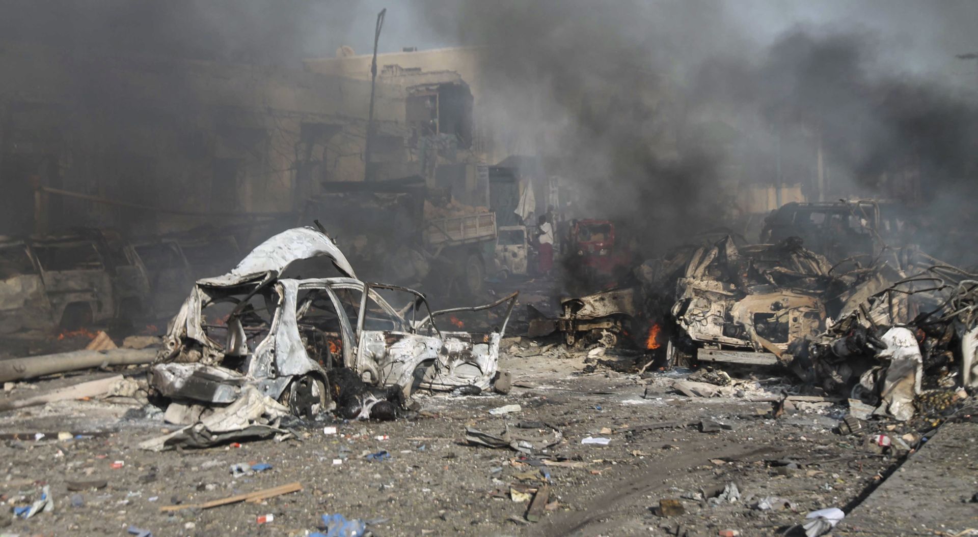 epa06279616 (FILE) - Destroyed vehciles are seen at the scene of a massive explosion in front of Safari Hotel in the capital Mogadishu, Somalia, 14 October 2017 (reissued 21 October 2017). According to media reports on 21 October 2017, government sources state that the death toll from the explosion, caused after a truck bomb went off on a busy street in central Mogadishu, has risen to 358 people. The blast is the deadliest attack in the country's history, and was blamed on al-Shahaab, an armed islamist group active in East Africa.  EPA/SAID YUSUF WARSAME