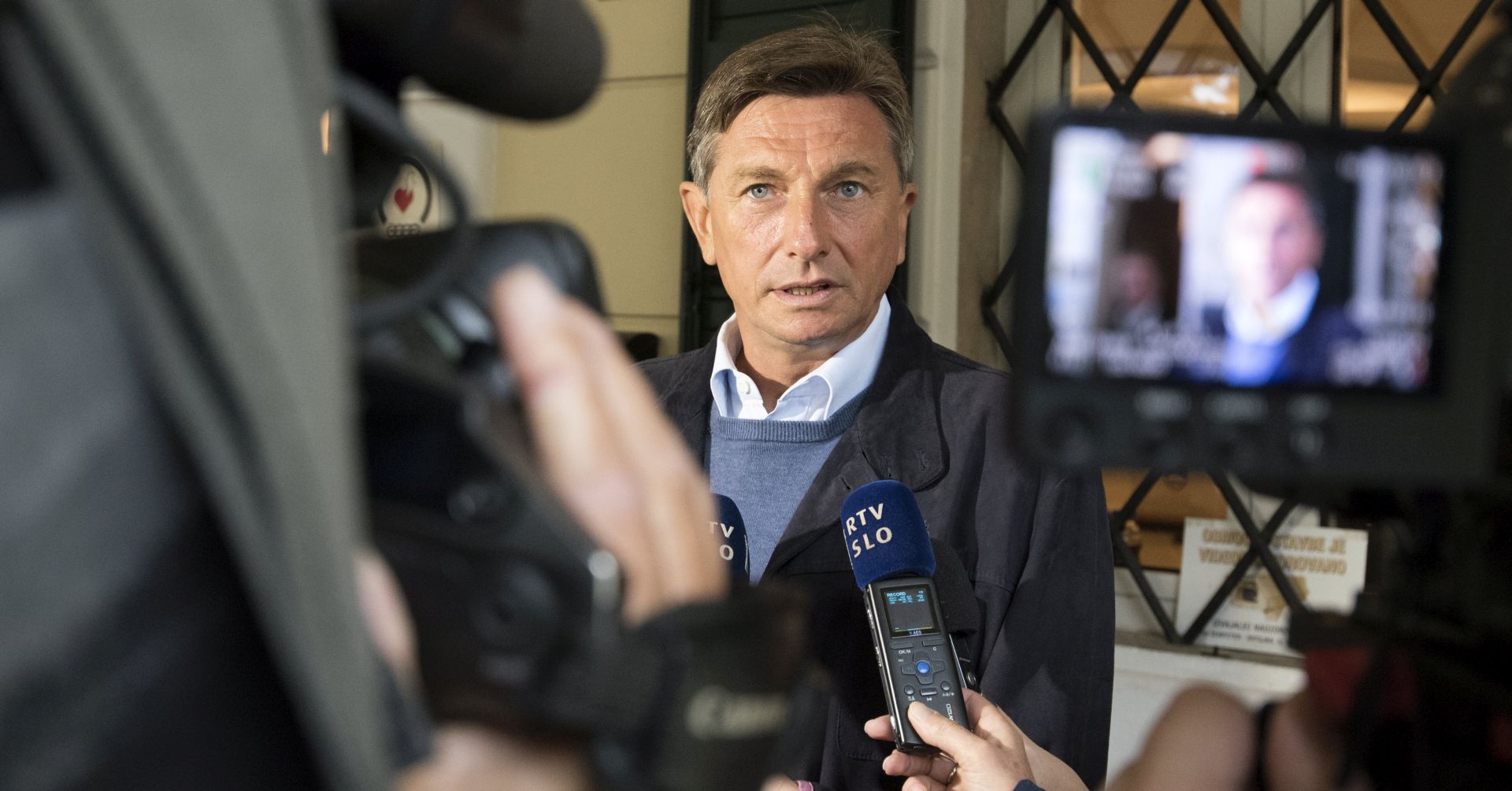 epa06281805 Borut Pahor, the incumbent Slovenian President, speaks to the media after casting his vote during the Slovenian Presidential Elections, at polling station in Nova Gorica, Slovenia, 22 October 2017. If no candidate receives a majority of the vote, a run-off will be held within the next three weeks.  EPA/IGOR KUPLJENIK