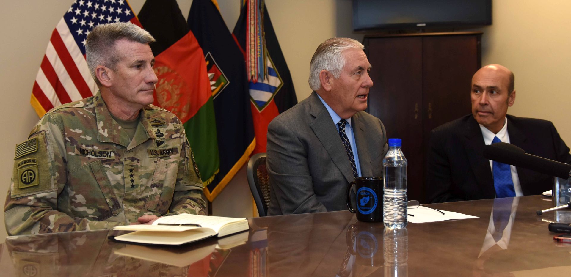 epa06284657 A handout photo made available by the US State Department shows US Secretary of State Rex Tillerson (C) flanked by Ambassador Hugo Llorens (R), Special Charge d'Affaires of the US Embassy in Kabul and General John W. Nicholson Jr. (R), addresses reporters at Bagram Airfield,  Parwan Province, Afghanistan, 23 October 2017. Tillerson arrived in Kabul on 23 October for a surprise visit and met with the Afghan President Ashraf Ghani in Kabul during which he reaffirmed the US-Afghan commitment to achieving peace, stability and long-term prosperity in Afghanistan.  EPA/US STATE DEPARTMENT HANDOUT  HANDOUT EDITORIAL USE ONLY/NO SALES