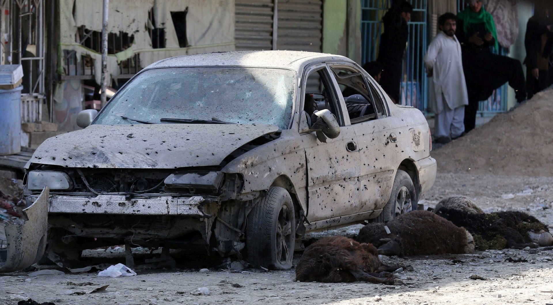 epa06234241 Dead livestock lie on the ground at the scene of a suicide bomb attack targeting Shiite Muslims Mosque during Friday congregational prayers in Kabul, Afghanistan, 29 September 2017. At least six people were killed and 20 injured when a suicide bomber attacked a Shiite Muslims Mosque in Kabul.  EPA/HEDAYATULLAH AMID