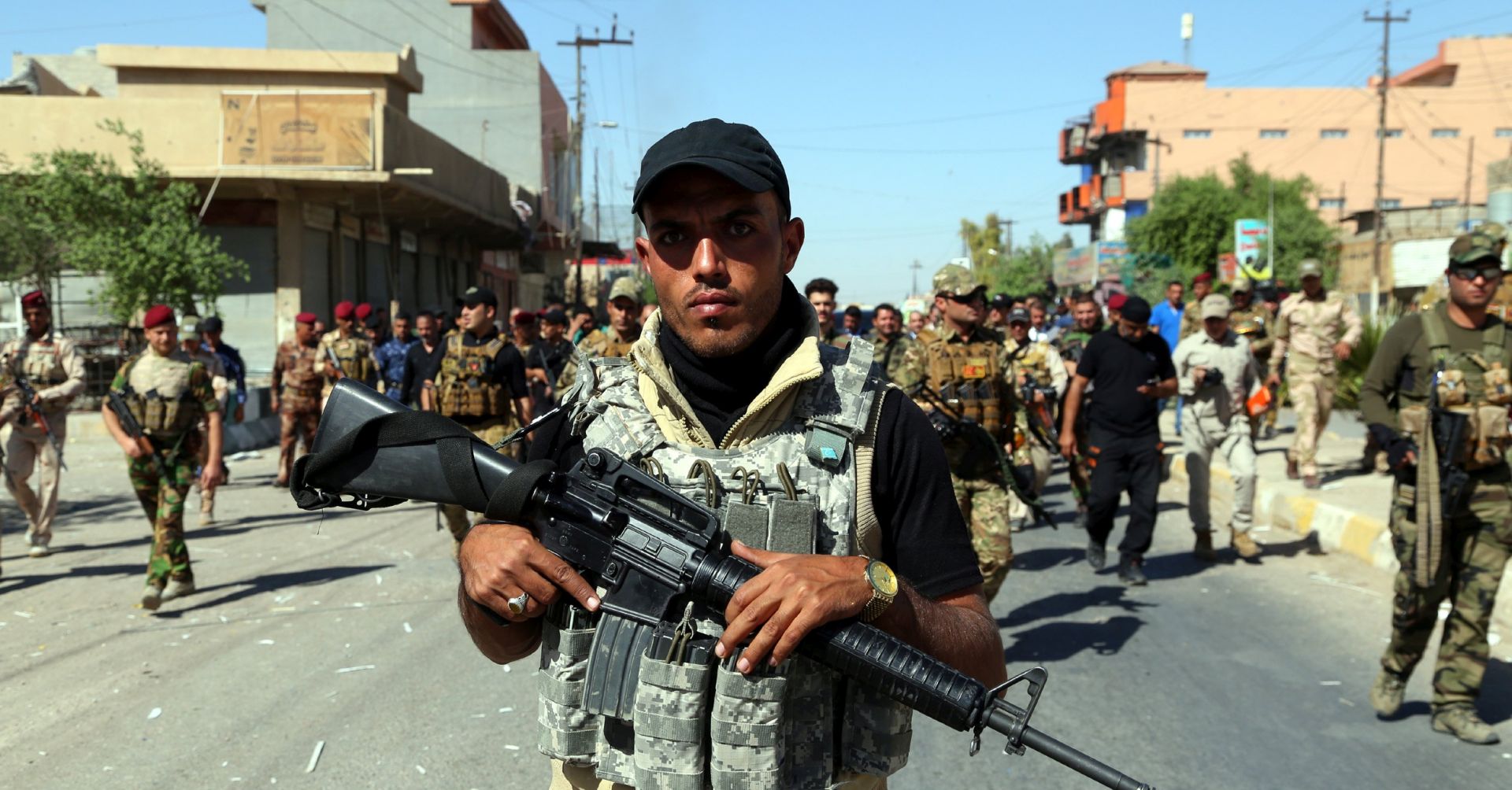 epa06272610 Members of Iraqi Shiite group known as Hashd al-Shaabi (The Popular Crowd) patrol an area in Tuz, southern Kirkuk city, Iraq, 17 October 2017 (issued 18 October 2017). Iraqi military forces launched operations against Kurdish forces around Kirkuk early on 16 October 2017, and took control of the largests oil fields in the disputed city after Kurdish forces withdrew.  EPA/BAREQ AL-SAMARRAI