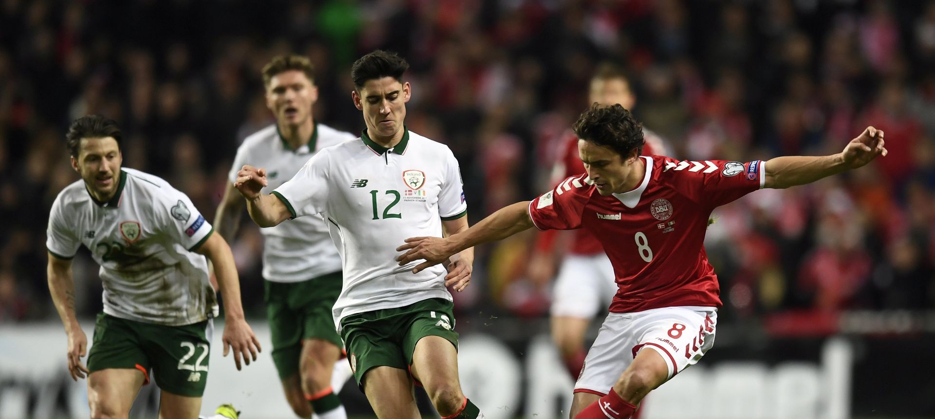 epa06323352 Callum O'Dowda (C) of Ireland in action against Thomas Delaney (R) of Denmark during the FIFA World Cup 2018 play-off first leg soccer match between Denmark and Ireland in Copenhagen, Denmark, 11 November 2017.  EPA/LARS MOELLER  DENMARK OUT