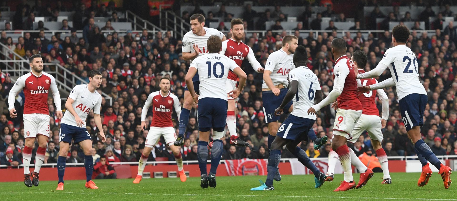 epa06336923 Arsenal's Shkodran Mustafi (C-R) goes for a header to score the opening goal during the English Premier League game between Arsenal and Tottenham Hotspurs at the Emirates stadium in London, Britain, 18 November 2017.  EPA/FACUNDO ARRIZABALAGA EDITORIAL USE ONLY. No use with unauthorized audio, video, data, fixture lists, club/league logos or 'live' services. Online in-match use limited to 75 images, no video emulation. No use in betting, games or single club/league/player publications