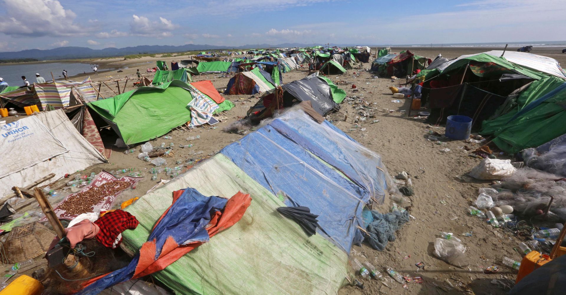 epa06325066 A general view over a makeshift camp at the beach at the Myanmar-Bangladesh border near the town of Maungsaw, Rakhine State, western Myanmar, 12 November 2017. Over 2,000 Rohingya people have found refuge in the makeshift camp near the Myanmar-Bangladesh border, waiting to cross to the Bangladesh side. In its latest report, the UN Inter-Sectoral Coordination Group put the number of Rohingyas who had arrived in Bangladesh in the last two and a half months at 613,000, of which the UNICEF estimated that 60 percent were children. The Rohingya crisis started on 25 August, when Rohingya rebels launched a series of attacks on multiple government posts in the region, leading the Myanmar army to unleash an ongoing large-scale military offensive and what the UN descirbed as 'ethnic clensing'. Myanmar does not recognize the Rohingyas as citizens and imposes various restrictions on them, including limitations on their movements within the country.  EPA/HEIN HTET ATTENTION: This Image is part of a PHOTO SET