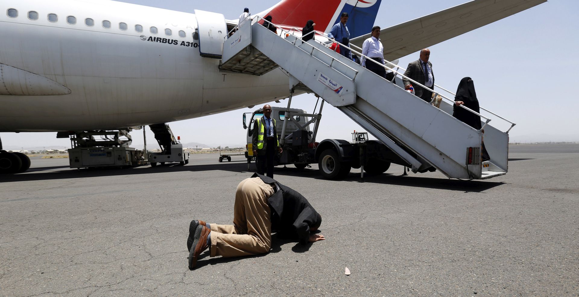 epa06344256 (FILE) - A Yemeni, who has been stranded in Egypt by fighting in Yemen, prays after arriving at Sana'a International Airport, Sana'a, Yemen, 20 May 2015 (reissued 22 November 2017). Saudi-led military coalition fighting in Yemen said on 22 November 2017 it will reopen the port of Hodeidah and the Sanaa airport to receive humanitarian and relief materials, adding that it will soon announce a 'comprehensive humanitarian operations plan' for assistance and relief to the Yemeni peopleâ€™. The coalition, fighting against the Houthi rebels in Yemen since 2015, had announced on 06 November a temporary blockade of all Yemeni air, sea and land ports, but was criticized for hindering the arrival of humanitarian aid to the war-ridden country.  EPA/YAHYA ARHAB *** Local Caption *** 51948309