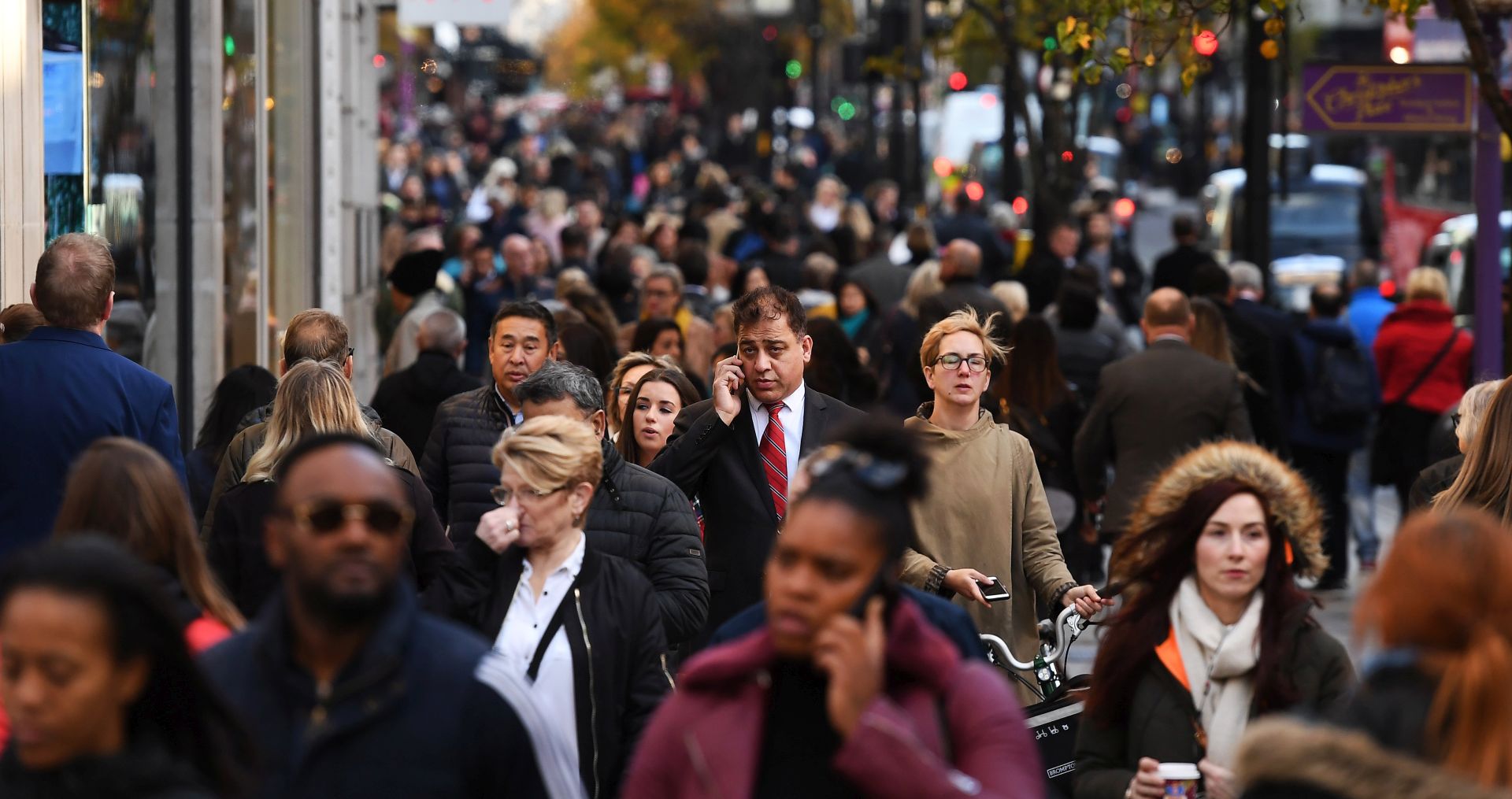 epa06345696 Shoppers walk down Oxford Street in London,  Britain, 23 November 2017. According to economic forecasts the UK is set to undergo five years of negative growth. UK earnings in 2022 could still be less than in when the financial crisis hit in 2008.  EPA/ANDY RAIN