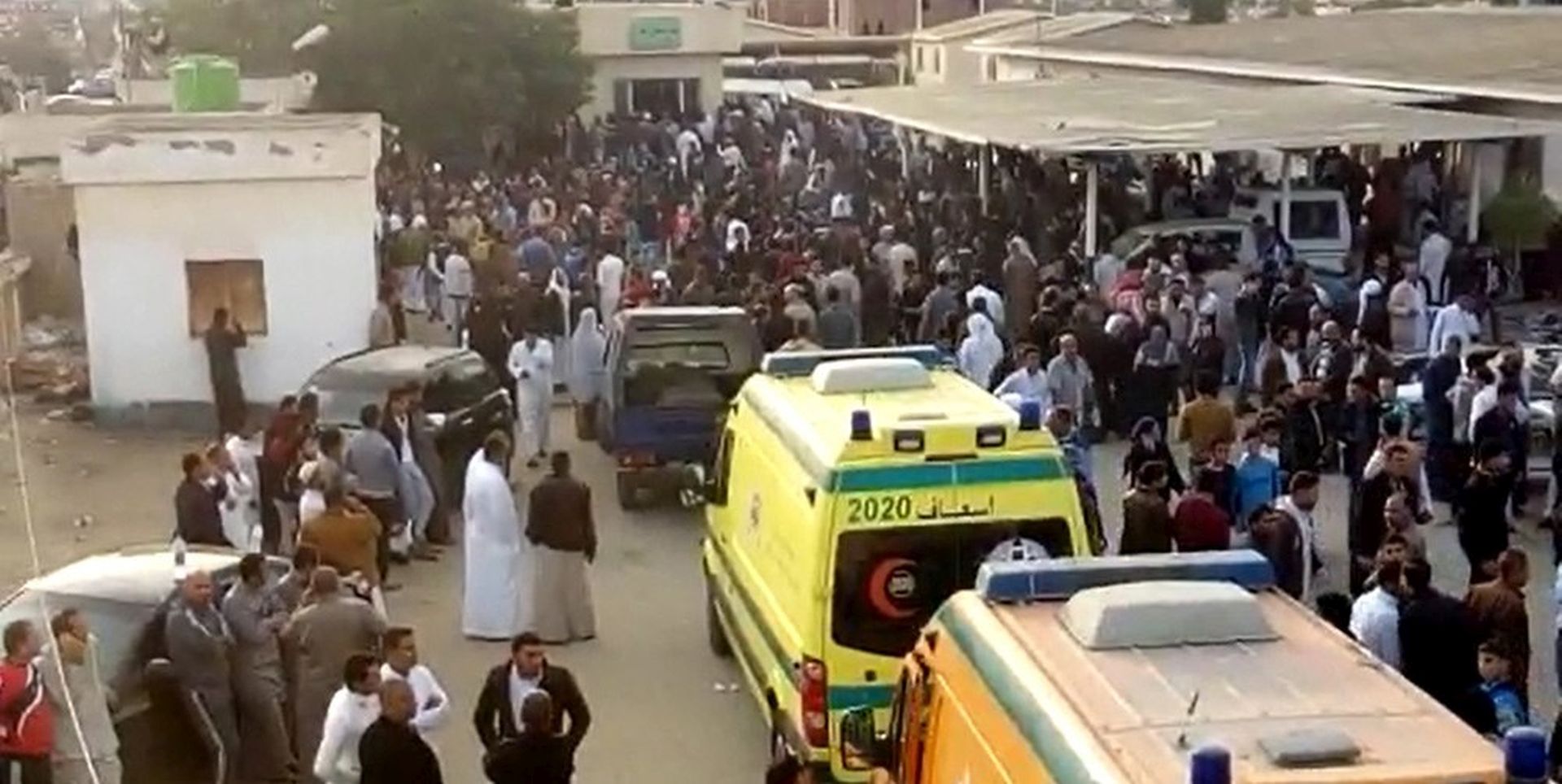 epa06348801 A grab image taken from taken from a video footage shows people and ambulances waiting to evacuate victims outside the mosque that was attacked in the northern city of Arish, Sinai Peninsula, Egypt, 24 November 2017. According to reports, at least 270 people were killed and 90 injured after a bomb was detonated at a mosque and fire opened on worshippers in the Sinai town of Bir al-Abd, near Arish.  EPA/STR BEST QUALITY AVAILABLE