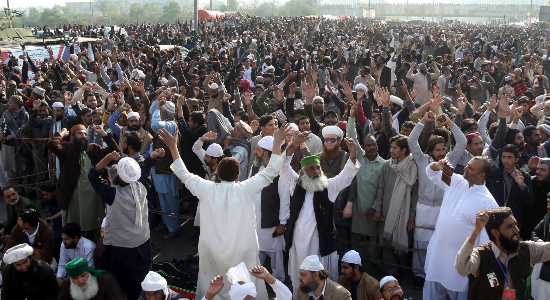 epa06351820 Supporters of religous group 'Tehrik Labayk Ya Rasool Allah (TLYRA)' attend the funeral of one of the victims who was killed a day earlier during violent protests, in Islamabad, Pakistan, 26 November 2017. TYLRA, a hardline Islamist group, which has been blocking a key highway in Pakistan for 19 days, clashed with the police on 26 November. Six people were killed and hundreds more injured, while the army took up positions in government buildings. The protests had erupted after the Pakistani Parliament approved an amendment to the electoral law on 02 October, removing an oath public servants had to take before assuming office, reiterating their belief in Prophet Mohammed as the last prophet of Islam. Following massive protests by hardline Islamists, three days later the parliament reinstated the article and Zahid Hamid, the justice minister had issued a video to pacify the protesters.  EPA/SOHAIL SHAHZAD
