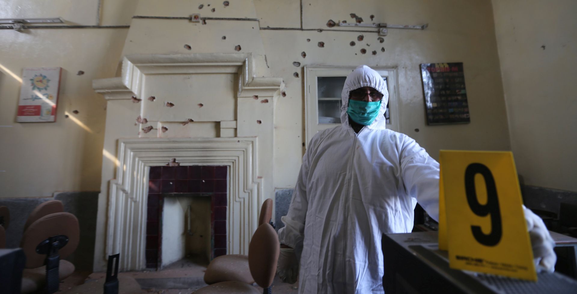 epa06360796 A Pakistani security official inspects the scene of a terrorist attack at Peshawar Univeristy in Peshawar, Pakistan, 01 December 2017. At least nine people were killed and dozens were injured when terrorists from the Tehrik-e-Taliban Pakistan attacked the Department of Agriculture at Peshawar University in Peshawar. Pakistan has launched several military operations against insurgent groups throughout the country in recent months following multiple major attacks in 2017.  EPA/ARSHAD ARBAB