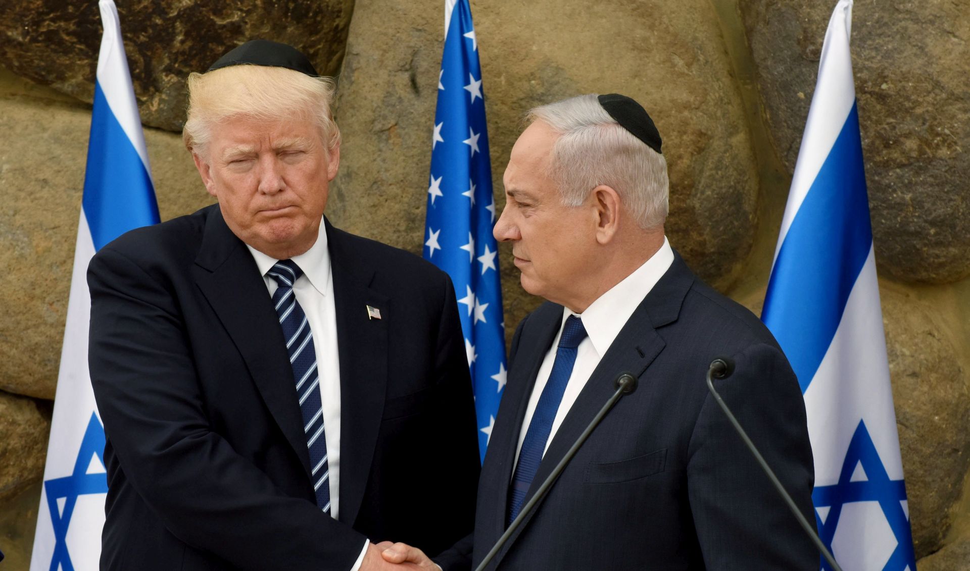 epa06369210 (FILE) - US President Donald Trump (L) and Israeli President Benjamin Netanyahu (R) shake hands, during a visit to the Yad Vashem Holocaust Memorial museum, commemorating the six million Jews killed by the Nazis during World War II, Jerusalem, 23 May 2017, (reissued 05 December 2017). According to media reports on 05 December 2017 state that US President Donald J. Trump has informed Palestinian leader Mahmoud Abbas that he intends to relocate the US embassy from Tel Aviv to Jerusalem.  EPA/DEBBIE HILL / POOL *** Local Caption *** 53539032