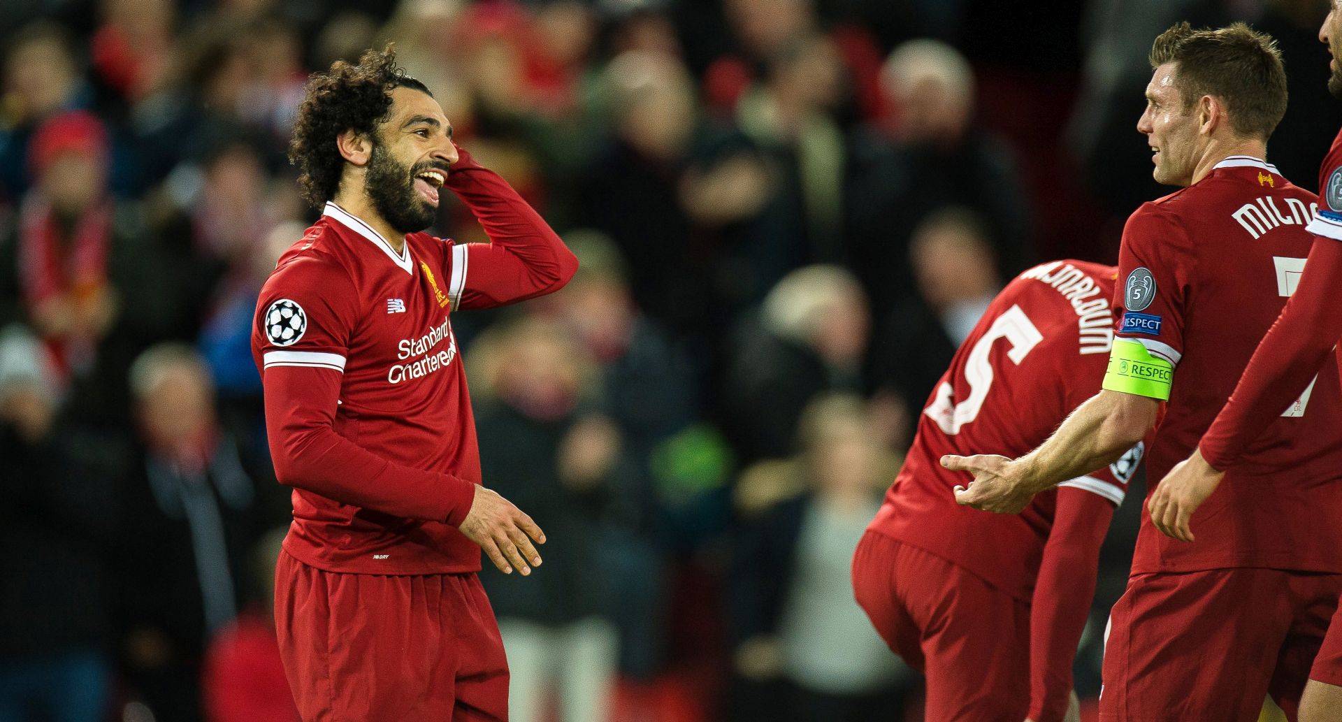 epa06372574 Liverpool's Mohamed Salah (L) celebrates after scoring the 7-0 lead during the UEFA Champions League group E soccer match between Liverpool FC and Spartak Moscow at Anfield in Liverpool, Britain, 06 December 2017.  EPA/PETER POWELL