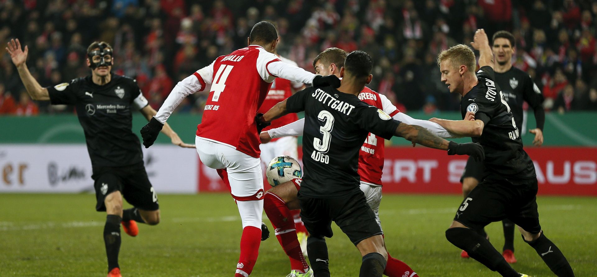 epa06399015 Mainz's Abdou Diallo (L) scores the 2-1 lead goal during the German DFB Cup Round of 16 soccer match between FSV Mainz 05 and VfB Stuttgart in Mainz, Germany, 19 December 2017.  EPA/RONALD WITTEK (ATTENTION: The DFB prohibits the utilisation and publication of sequential pictures on the internet and other online media during the match (including half-time). ATTENTION: BLOCKING PERIOD! The DFB permits the further utilisation and publication of the pictures for mobile services (especially MMS) and for DVB-H and DMB only after the end of the match.)