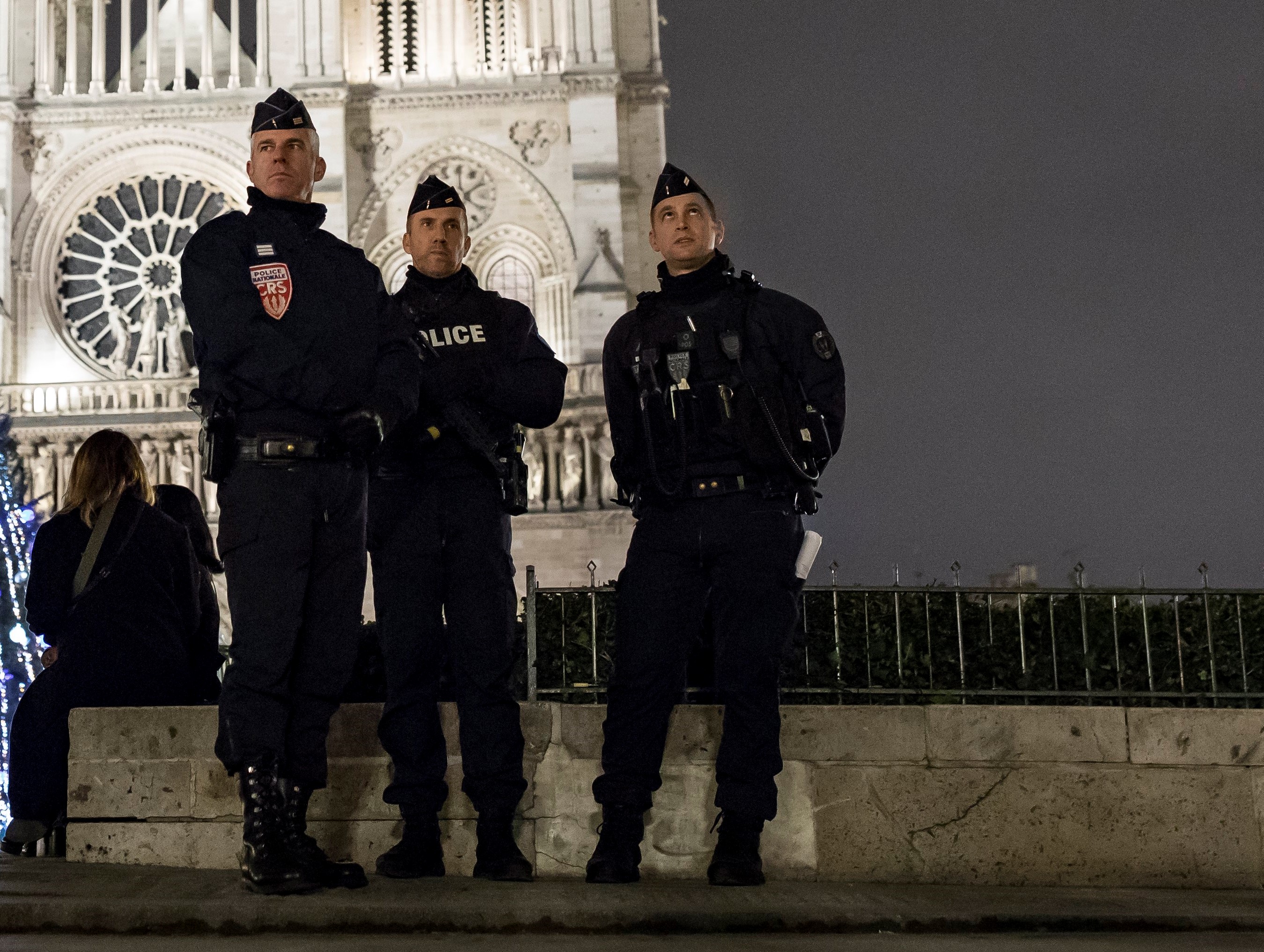 epa06404819 Armed police secure the perimeter around Notre-Dame cathedral during Christmas eve mass, in Paris, France, 24 December 2017. Security measures have been stepped up across France, with additional police presence and checkpoints established at key touist sites for the holiday season.  EPA/IAN LANGSDON
