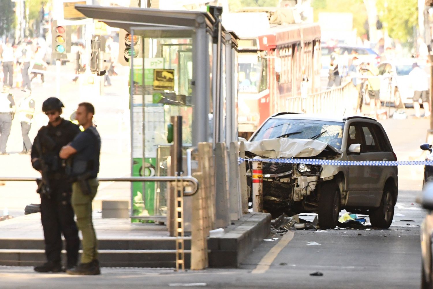 epa06402147 A damaged vehicle at the scene of an incident on Flinders Street, in Melbourne, Australia, 21 December 2017. Twelve people are being treated by paramedics after a car, understood to be a white Suzuki SUV, ploughed into pedestrians in central Melbourne.  EPA/JOE CASTRO AUSTRALIA AND NEW ZEALAND OUT