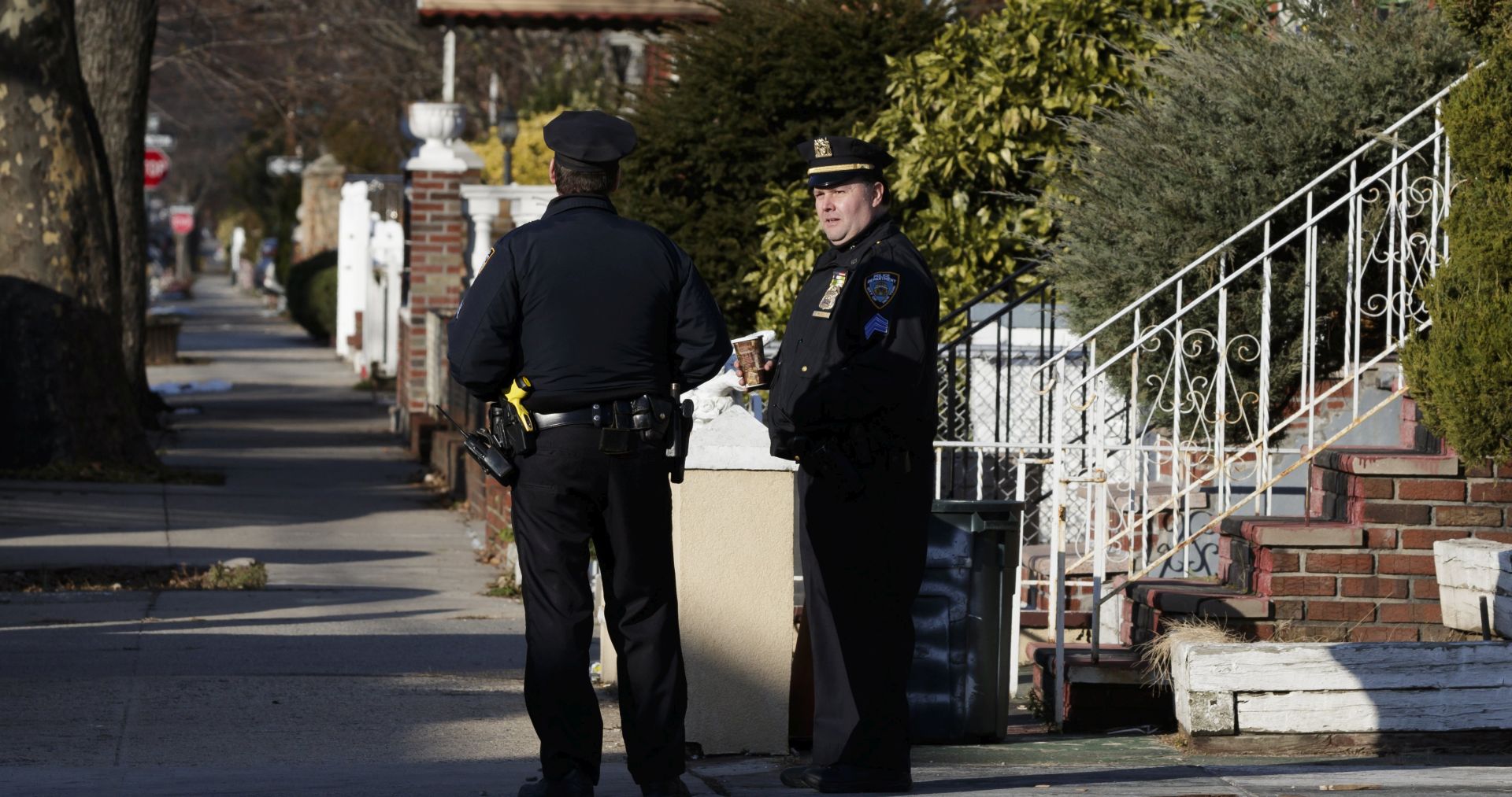 epa06383586 Police officers gather outside the home of the man suspected of carrying out an explosion at New York's Port Authority Bus Terminal in Brooklyn, New York, USA, 11 December 2017. Reports indicate some injuries and that a suspect is in custody.  EPA/JUSTIN LANE