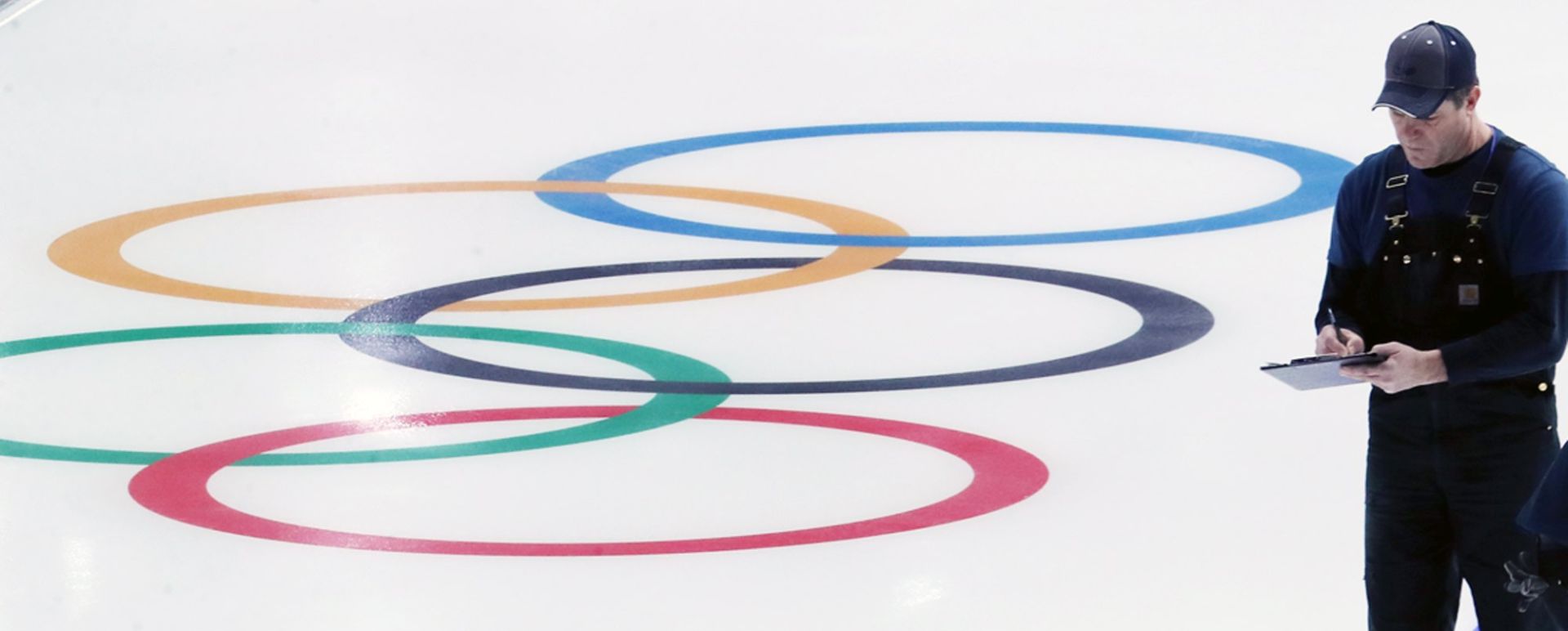 epa06428246 An official checks the ice quality of a rink at the Gangneung Oval, which will host speed skating races at the 2018 PyeongChang Winter Olympics in the city of Gangneung, South Korea, 10 January 2018, as the country marked the 30-day countdown to the 09 to 25 February event.  EPA/YONHAP SOUTH KOREA OUT