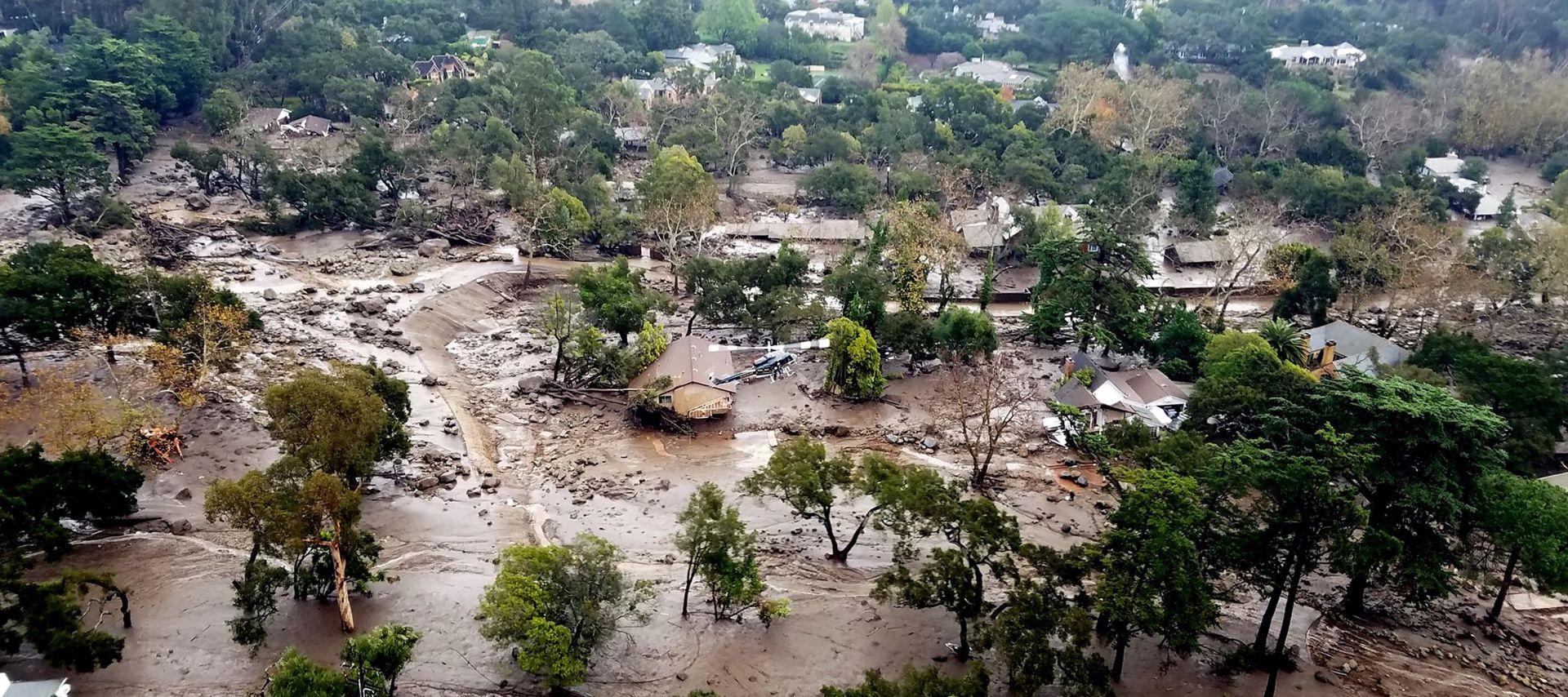 epa06430053 A handout photo made available by the Santa Barbara County Fire Department shows an aerial view taken aboard Santa Barbara County Air Support Unit's Fire Copter 308 of mudflow and damage following heavy rains in Montecito, California, USA, 10 January 2018. Heavy rains combined with large areas burned by the Thomas Fire combined for flash flooding and mudslide risk.  EPA/MATT UDKOW/SANTA BARBARA COUNTY FIRE HANDOUT  HANDOUT EDITORIAL USE ONLY/NO SALES