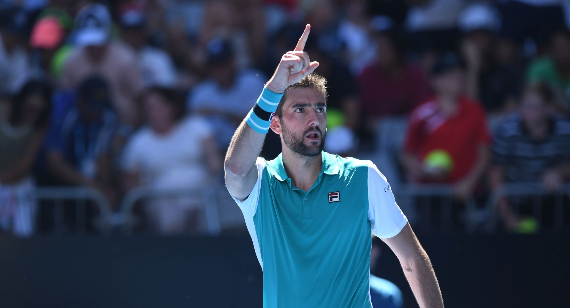 epa06445312 Marin Cilic of Croatia celebrates his win against Joao Sousa of Portugal during the second round on day three of the Australian Open tennis tournament in Melbourne, Victoria, Australia, 17 January 2018.  EPA/JULIAN SMITH  AUSTRALIA AND NEW ZEALAND OUT