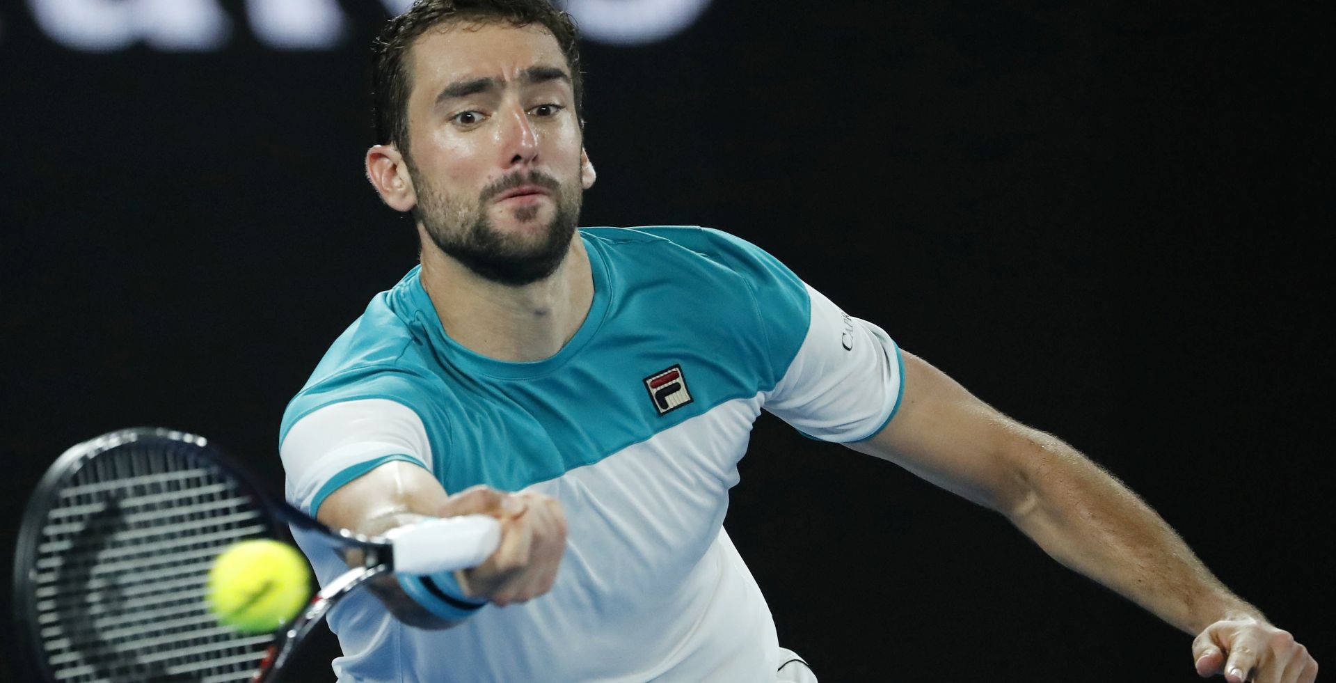 epa06480514 Marin Cilic of Croatia in action during his men's final match against Roger Federer of Switzerland at the Australian Open Grand Slam tennis tournament in Melbourne, Australia, 28 January 2018.  EPA/MAST IRHAM