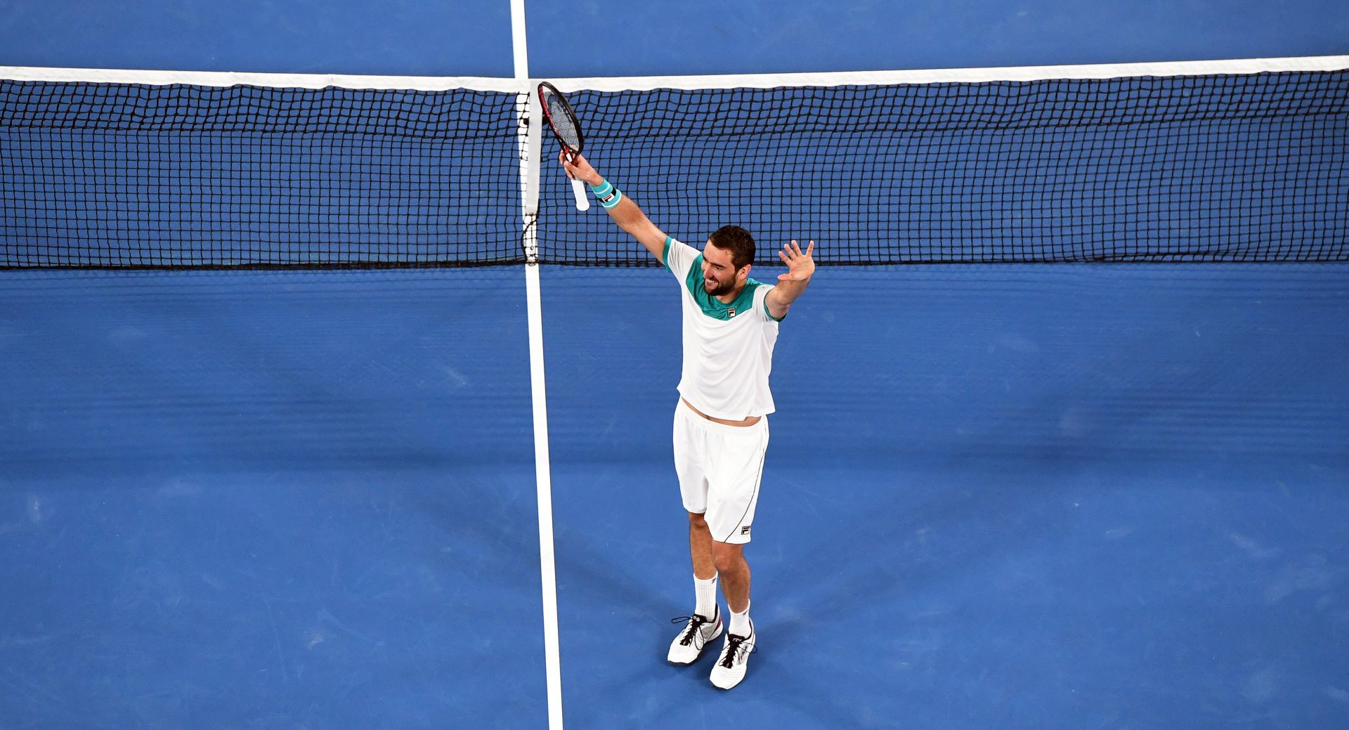 epa06473187 Marin Cilic of Croatia celebrates after winning his men's semi final match against Kyle Edmund of Britain at the Australian Open Grand Slam tennis tournament in Melbourne, Australia, 25 January 2018.  EPA/JULIAN SMITH AUSTRALIA AND NEW ZEALAND OUT
