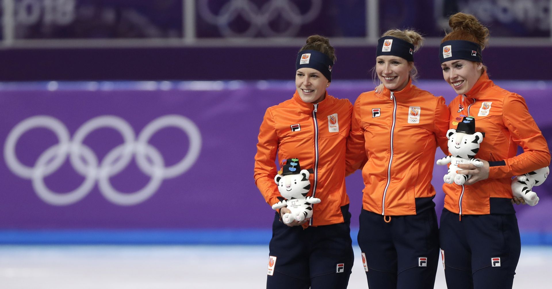 epa06511249 (L-R) Ireen Wust of the Netherlands, who came second for a silver medal, Carlijn Achtereekte of the Netherlands, who won for gold and Antoinette de Jong who came third for bronze making a Dutch top three win, in the Women's Speed Skating 3000 m competition at the venue presentation ceremony at Gangneung Oval during the PyeongChang 2018 Olympic Games, South Korea, 10 February 2018.  EPA/VALDRIN XHEMAJ
