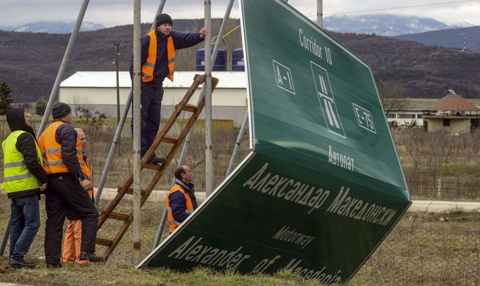 epa06549711 Workers remove a sign for the Highway Alexander of Macedonia Highway leading to the Greek border near capital of Skopje, The Former Yugoslav Republic of Macedonia, 21 February 2018. The Former Yugoslav Republic Of Macedonian public eagerly awaits the outcome of the intensive negotiations between the Macedonian and Greek governments regarding the problem of the name of the country. The country has been stuck with years in the effort to become a member of the NATO and EU because of the problem that Greece has about the name of the country. The FYROM Government made a decision to rename the Alexander the Great Airport to 'Skopje International airport' and Highway Alexander of Macedonia Highway leading to the Greek border to 'Friendship Highway'. Former Yugoslav Republic of Macedonia (FYROM) and Greece are seeking a solution in a dispute over Macedonia's name. Greece insists that FYROM's name implies territorial claims to its own northern province, called Macedonia.  EPA/NAKE BATEV