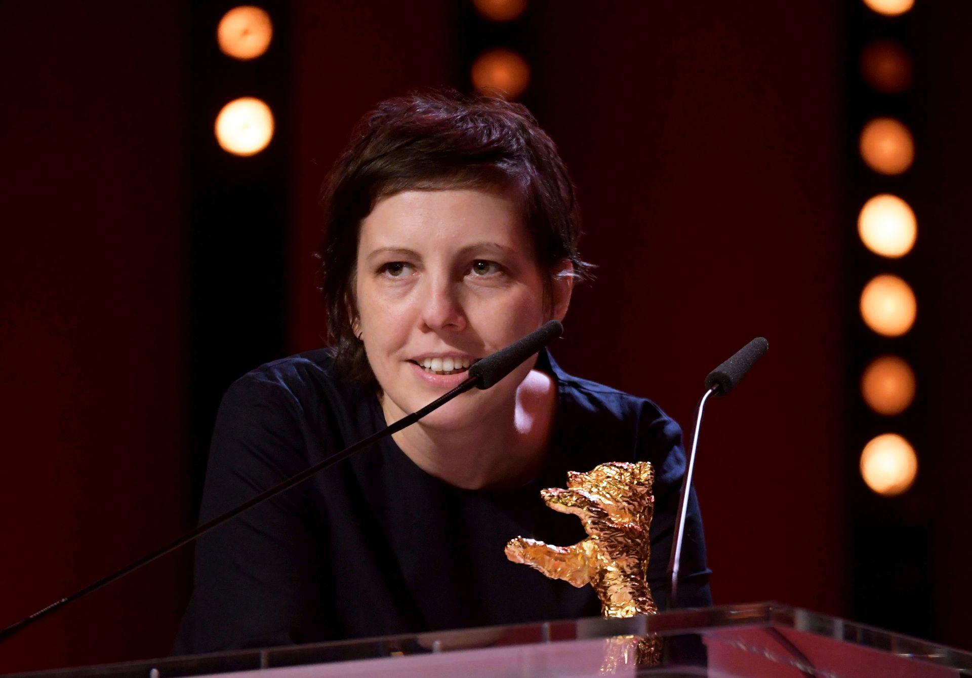 epa06561812 Romanian director Adina Pintilie receives the Golden Bear for Best Film for 'Touch Me Not' at the closing and award ceremony of the 68th annual Berlin International Film Festival (Berlinale), in Berlin, Germany, 24 February 2018. The Berlinale runs from 15 to 25 February.  EPA/CLEMENS BILAN