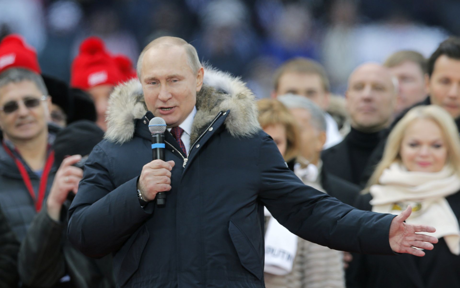 epa06576823 Russian President Vladimir Putin (C) addresses supporters during his pre-election campaign rally at Luzhniki stadium in Moscow, Russia, 03 March 2018. Vladimir Putin, a member of the ruling United Russia Party will run as an independent candidate in the presidential elections scheduled for 18 March.  EPA/YURI KOCHETKOV