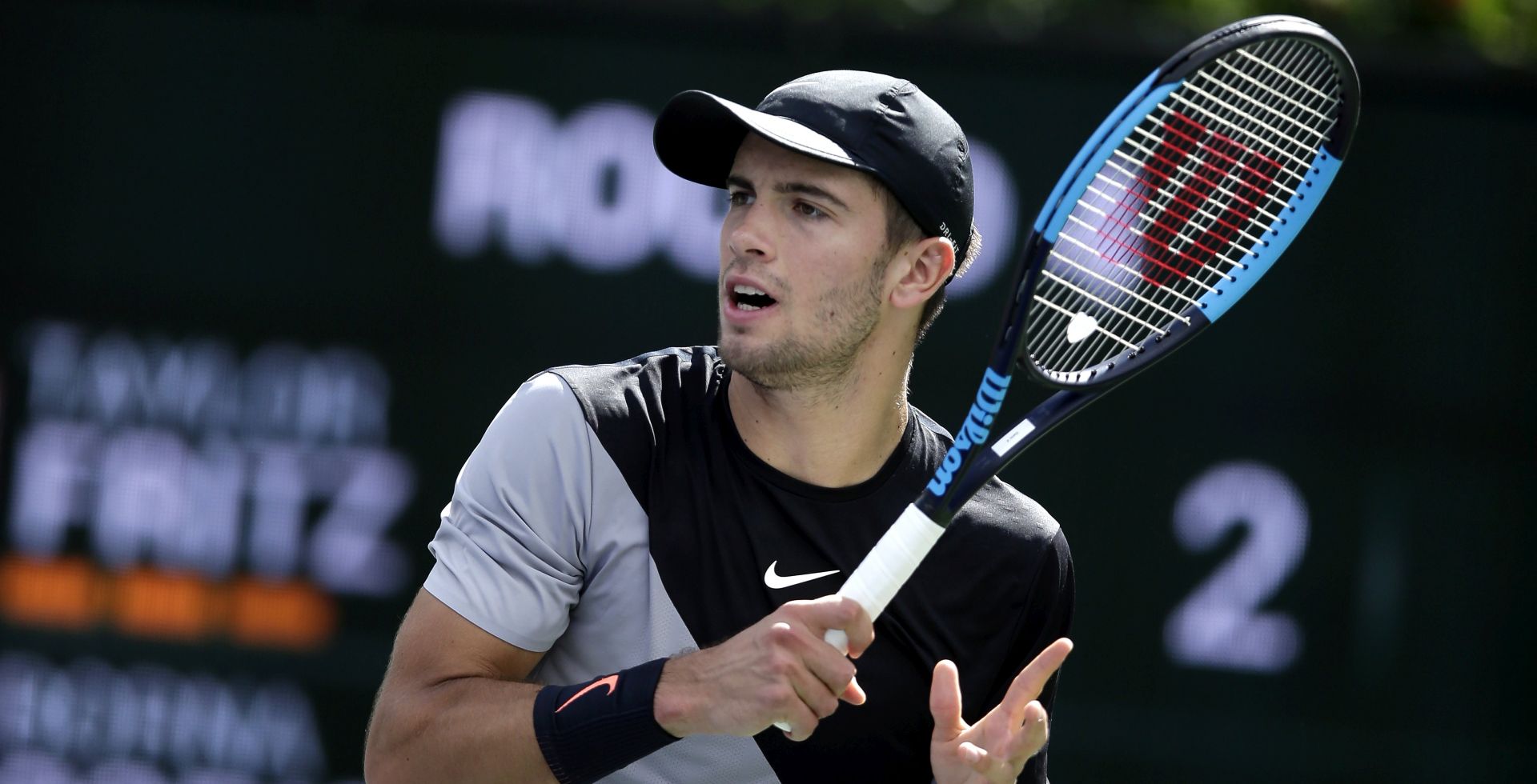 epa06604366 Borna Coric of Croatia in action against Taylor Fritz of USA during the BNP Paribas Open at the Indian Wells Tennis Garden in Indian Wells, California, USA, 14 March 2018.  EPA/PAUL BUCK