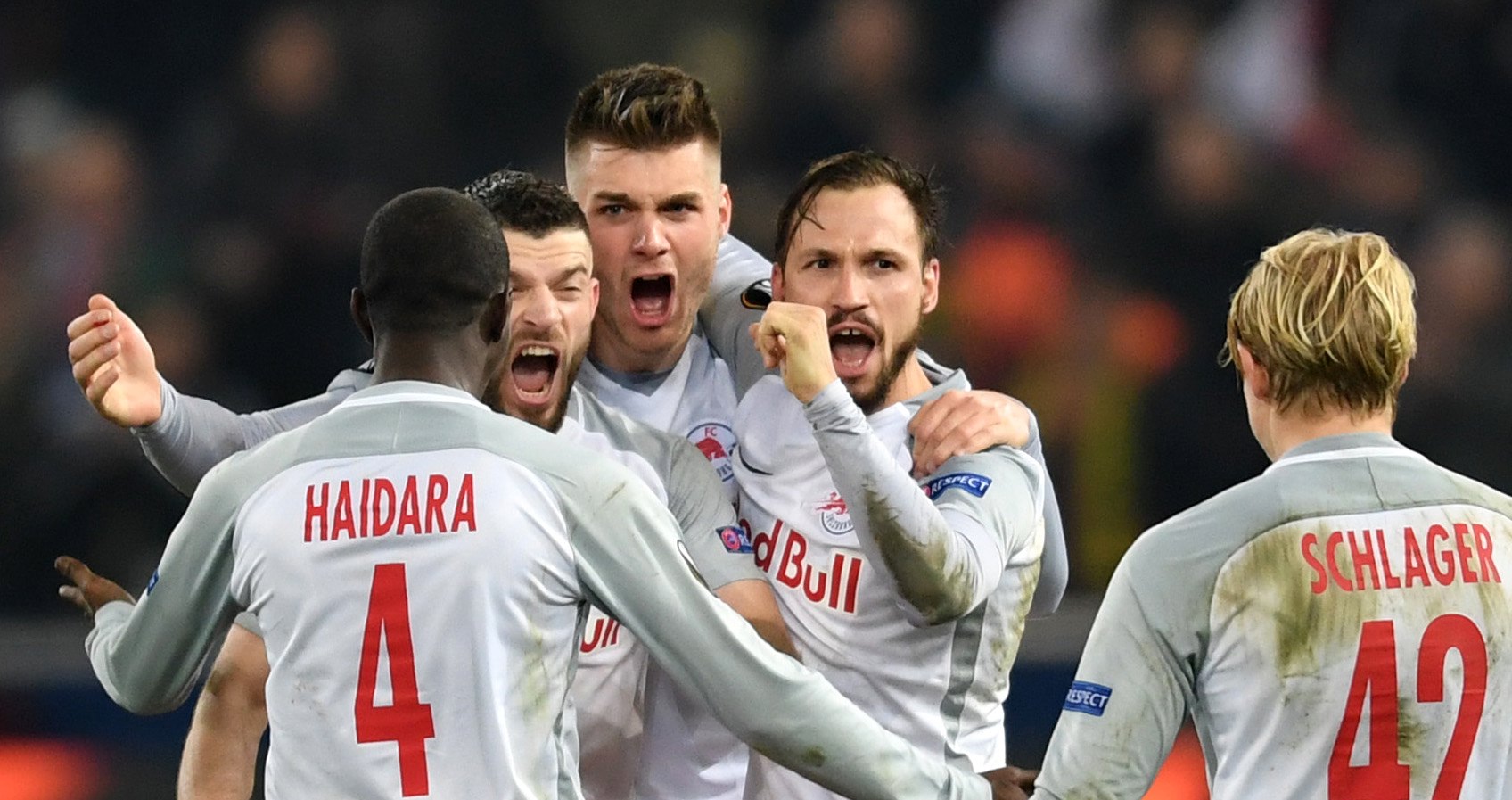 epa06606979 Players of Salzburg celebrate after the UEFA Europa League round of 16, second leg soccer match between RB Salzburg and Borussia Dortmund in Salzburg, Austria, 15 March 2018.  EPA/ANDREAS SCHAAD