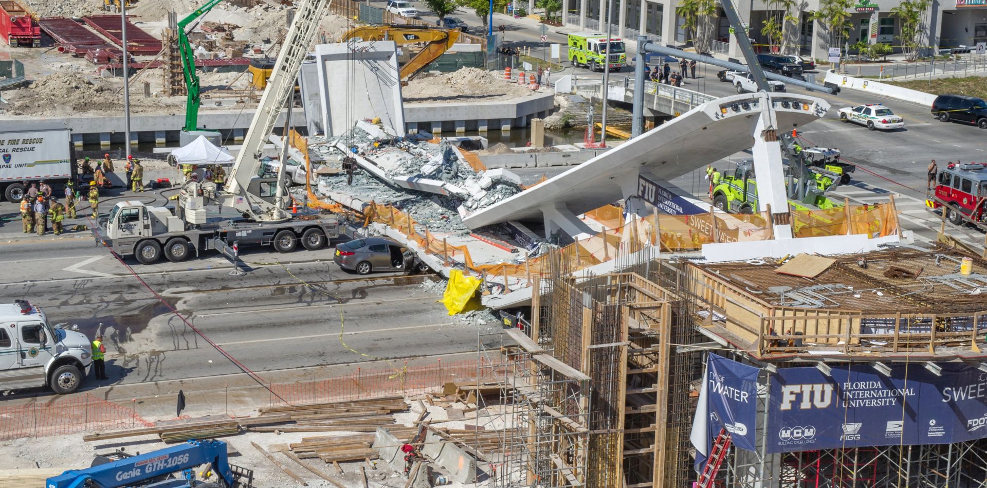 epaselect epa06606821 Emergency personnel works on a collapsed pedestrian bridge on the Florida International University in Miami, Florida, USA on 15 March 2018. A recently installed pedestrian bridge at Florida International University west of Miami collapsed, crushing several cars on a state highway and injuring multiple people, according to police.  EPA/GIORGIO VIERA