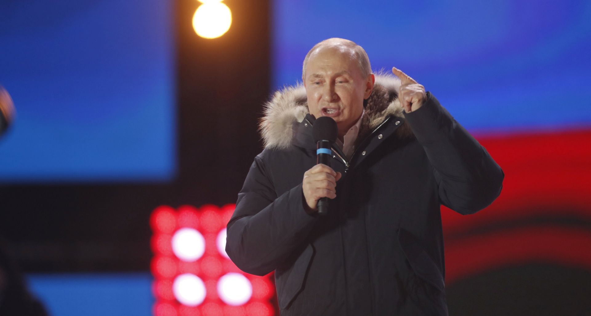 epa06613212 Russia's President Vladimir Putin delivers a speech during a rally at Manezhnaya Square near the Kremlin in Moscow, Russia, 18 March 2018. Russians are electing the President of Russia in the 18 March elections, with eight candidates contesting for the presidential seat, including the incumbent president Vladimir Putin, who leads with over 72 per cent of the vote and projected to win his fourth term in the Kremlin.  EPA/YURI KOCHETKOV