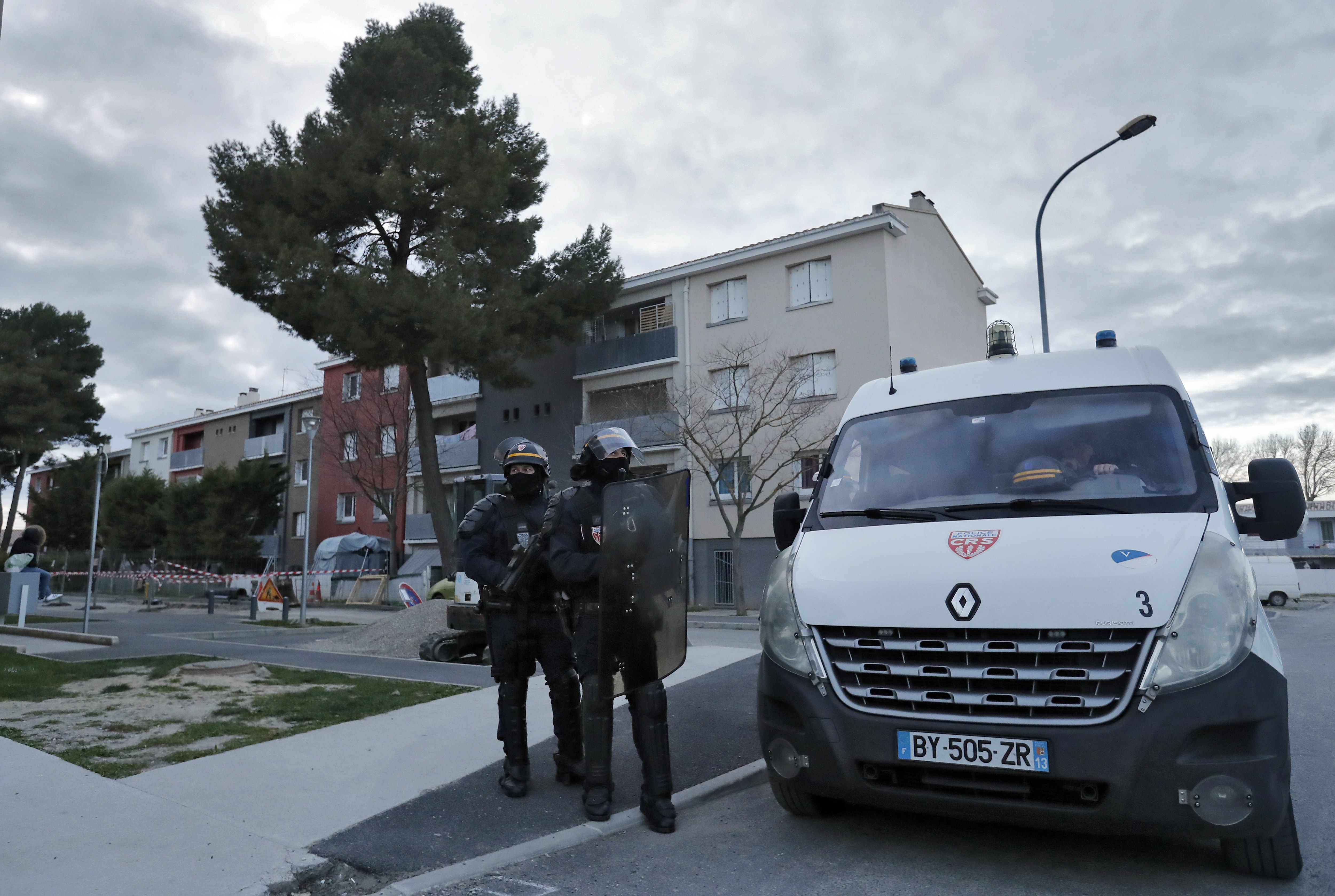 epa06624497 French 'Compagnies Republicaines de Securite' (CRS) national police secures the perimeter during a raid at the appartment of Redouane Ladkim in the Ozanam district of Carcassonne, southern France, 23 March 2018. Ladkim is identified as the gunman claiming allegiance to the Islamic State (IS) who shot and wounded a jogging police officer before opening fire and taking hostages at a Super U supermarket in the town of Trebes near Carcassonne. Three victims have been confirmed killed and 16 others injured in the attack.  EPA/GUILLAUME HORCAJUELO