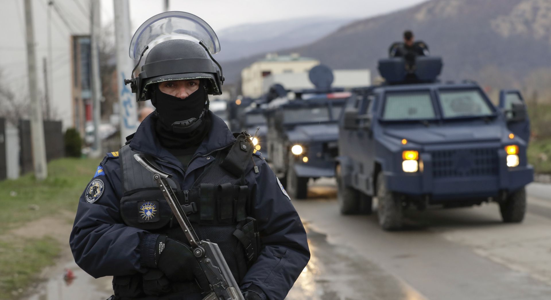 epa06630844 A member of Kosovo's police special unit stay guard near by the convoy carrying detained head of the Serbian governmentâ€™s Office for Kosovo, Marko Djuric, in Mitrovica, Kosovo, 26 March 2018. Kosovo Police special unit detained head of the Serbian governmentâ€™s Office for Kosovo, Marko Djuric, in northern city of Mitrovica for entering Kosovo despite a ban on his presence.  EPA/VALDRIN XHEMAJ