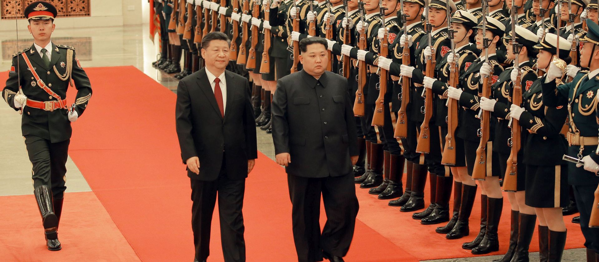 epa06633535 An undated photo released on 28 March 2018 by the North Korean Central News Agency (KCNA), the state news agency of North Korea, shows North Korean leader Kim Jong-un (C-R) walking with Chinese President Xi Jinping (C-L) as they inspect the honor guard during his visit to China. According to the North Korean media, Kim Jong-un visited China from 25 to 28 March at the invitation of Chinese President Xi Jinping.  EPA/KCNA   EDITORIAL USE ONLY