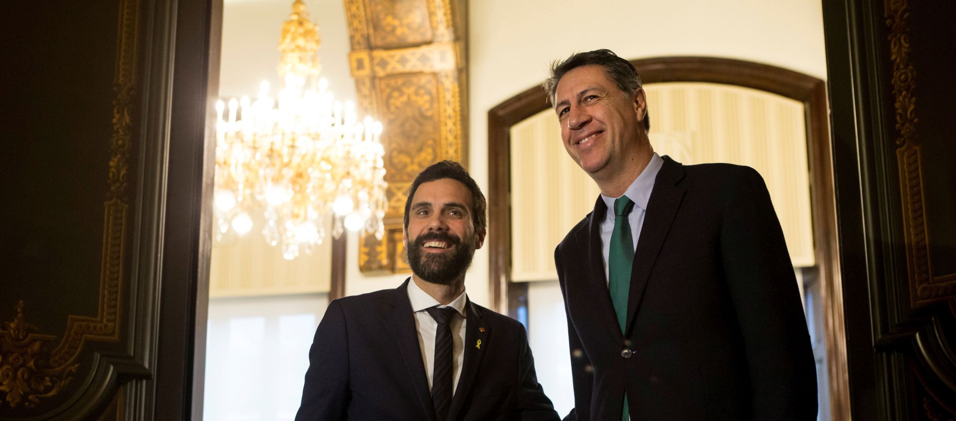 epa06582698 Catalan Parliament's Speaker Rogert Torrent (L) welcomes the PPC's leader Xavier Garcia Albiol (R) as part of his second round of talks with political parties in order to propose a new candidate for the Presidency of the Generalitat, in Barcelona, northeastern Spain, 05 March 2018. Torrent is holding meetings with all the Catalan forces even though the only proposed candidate at the moment JxCat party's Member in Parliament Jordi Sanchez, who is currenty in custody, has not ensured his election after the CUP party has rejected to vote him in an hypothetical inauguration at the regional Parliament.  EPA/QUIQUE GARCIA