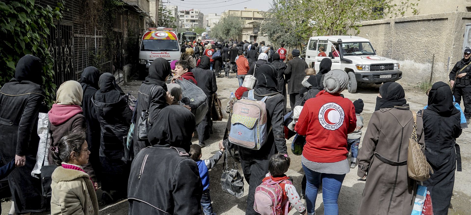 epa06627538 A handout photo made available by the official Syrian Arab News Agency (SANA) shows Syrian Civilians leave the rebels-held Eastern Ghouta via al-Wafideen safe corridor, Damascus,Syria , 24 March 2018. According to media reports, some 4500 people were evacuated earlier in the day by the Syrian government. According to SANA more than 105000 civilians have evacuated over the past days. Reports said that the Syrian army has recaptured more than 70 percent of Eastern Ghouta since the start of the military offensive. On 19 February 2018 the Syrian government started a military campaign to regain control of rebels-held Eastern Ghouta in Damascus countryside.  EPA/SANA HANDOUT  HANDOUT EDITORIAL USE ONLY/NO SALES