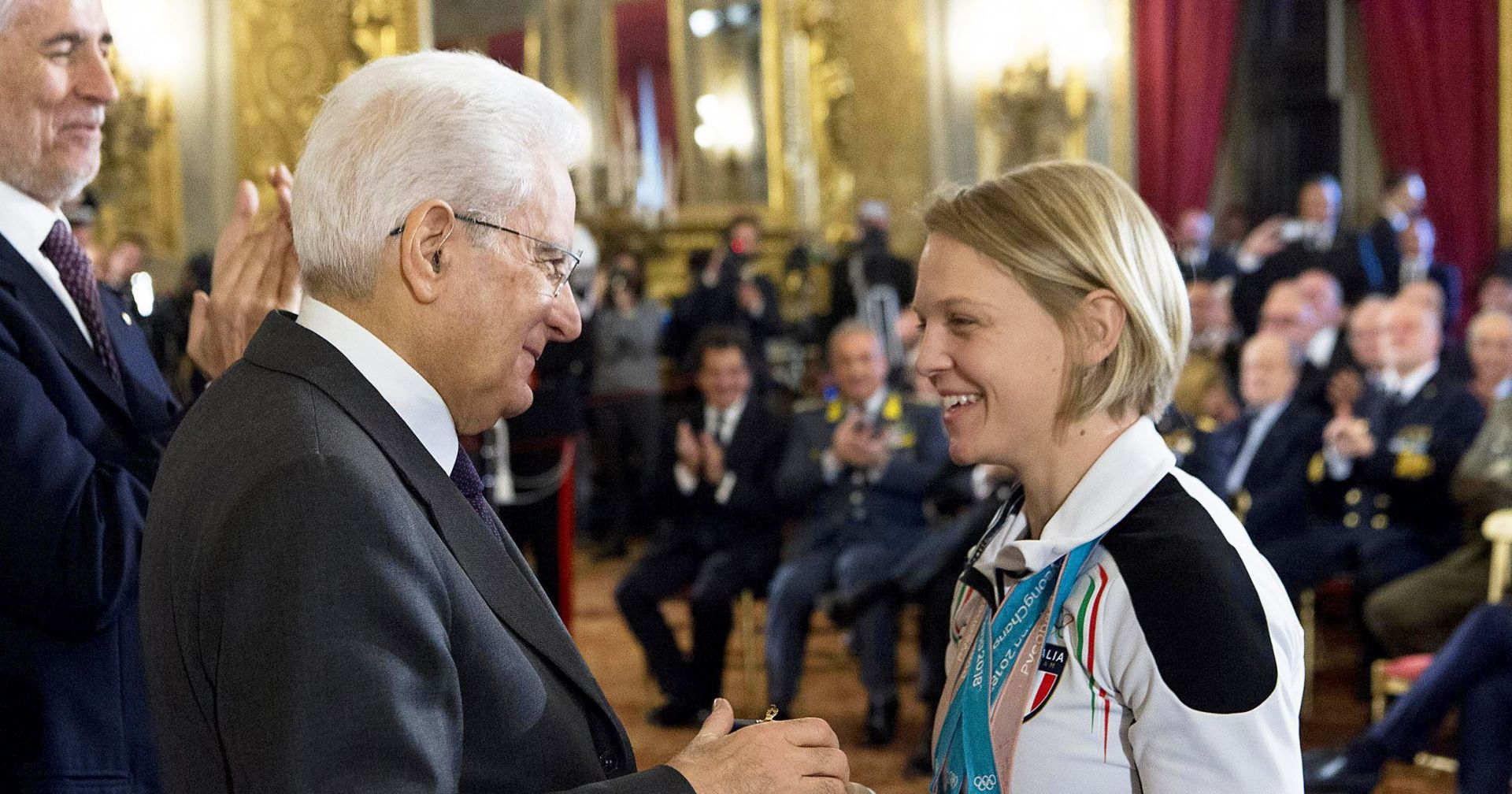 epa06631996 A handout photo made available by the Quirinale Palace press office of Italian President Sergio Mattarella (L) talking to Italian short track speed skater Arianna Fontana (R), multiple medalist at the PyeongChang 2018 Olympic Games, during a reception in Rome, Italy, 27 March 2018. Fontana won the gold medal in the women's 500m race of the Short Track Speed Skating events on 13 February 2018. She also took silver in the women's 3,000 relay and bronze in the 1,000m race.  EPA/PAOLO GIANDOTTI - QUIRINALE PALACE PRESS OFFICE  HANDOUT EDITORIAL USE ONLY/NO SALES