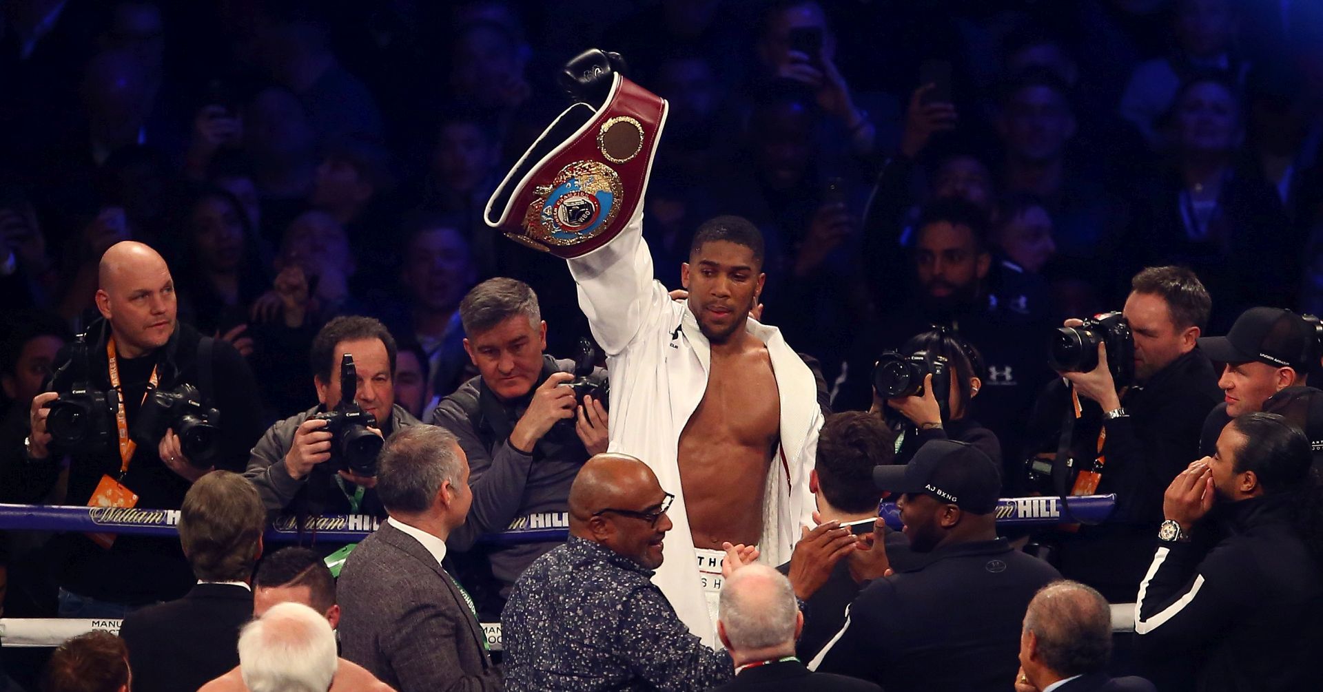 epa06639747 British boxer Anthony Joshua celebrates after beating New Zealand boxer Joseph Parker in their unifying Heavyweight Championship boxing title bout at Principality Stadium, Wales, Britain, 31 March 2018. The winner of the fight will hold the IBF, WBO, IBO and WBO heavyweight boxing titles.  EPA/GEOFF CADDICK