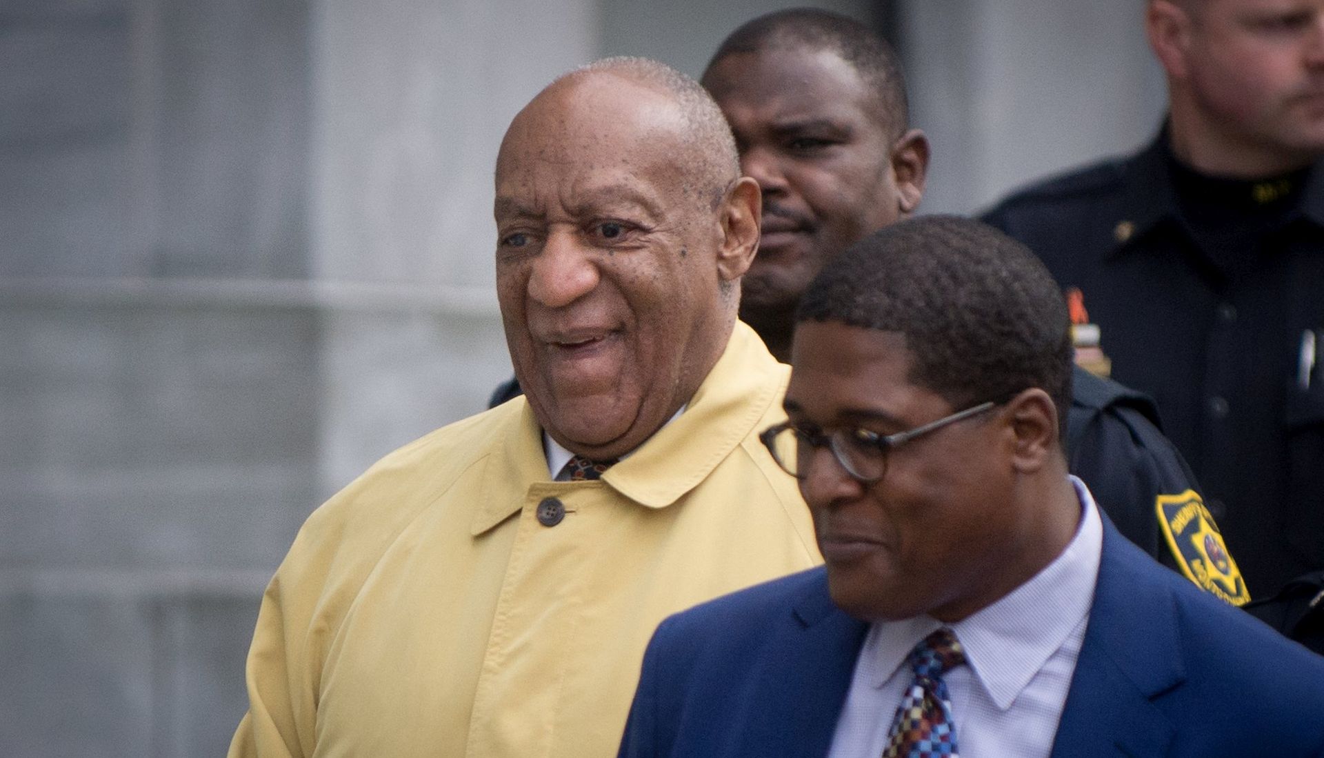 epa06642358 US entertainer Bill Cosby (L) departs the Montgomery County Courthouse in Norristown, Pennsylvania, USA, 2 April 2018 after the first day of jury selection for his retrial regarding charges stemming from an alleged sexual assault in 2004. Cosby has been charged with Aggravated Indecent Assault, which is a second degree felony, by the Pennsylvania prosecutor. His first trial in 2017 ended with a hung jury.  EPA/TRACIE VAN AUKEN