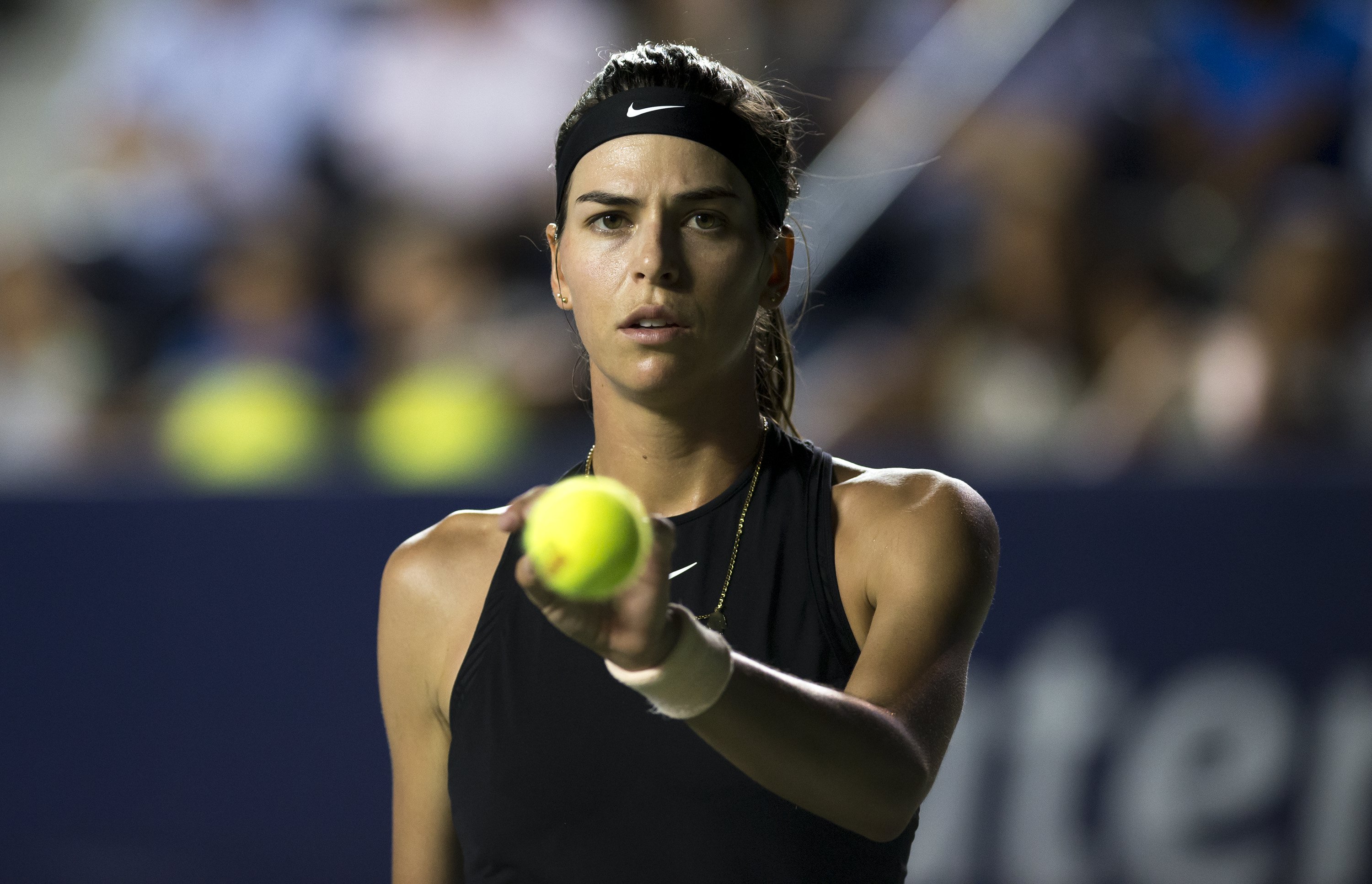 epa06651457 Ajla Tomljanovic of Australia in action against Garbine Muguruza of Spain during a quarter finals match of the Monterrey Tennis Open held in Monterrey, Mexico, 06 April 2018.  EPA/MIGUEL SIERRA