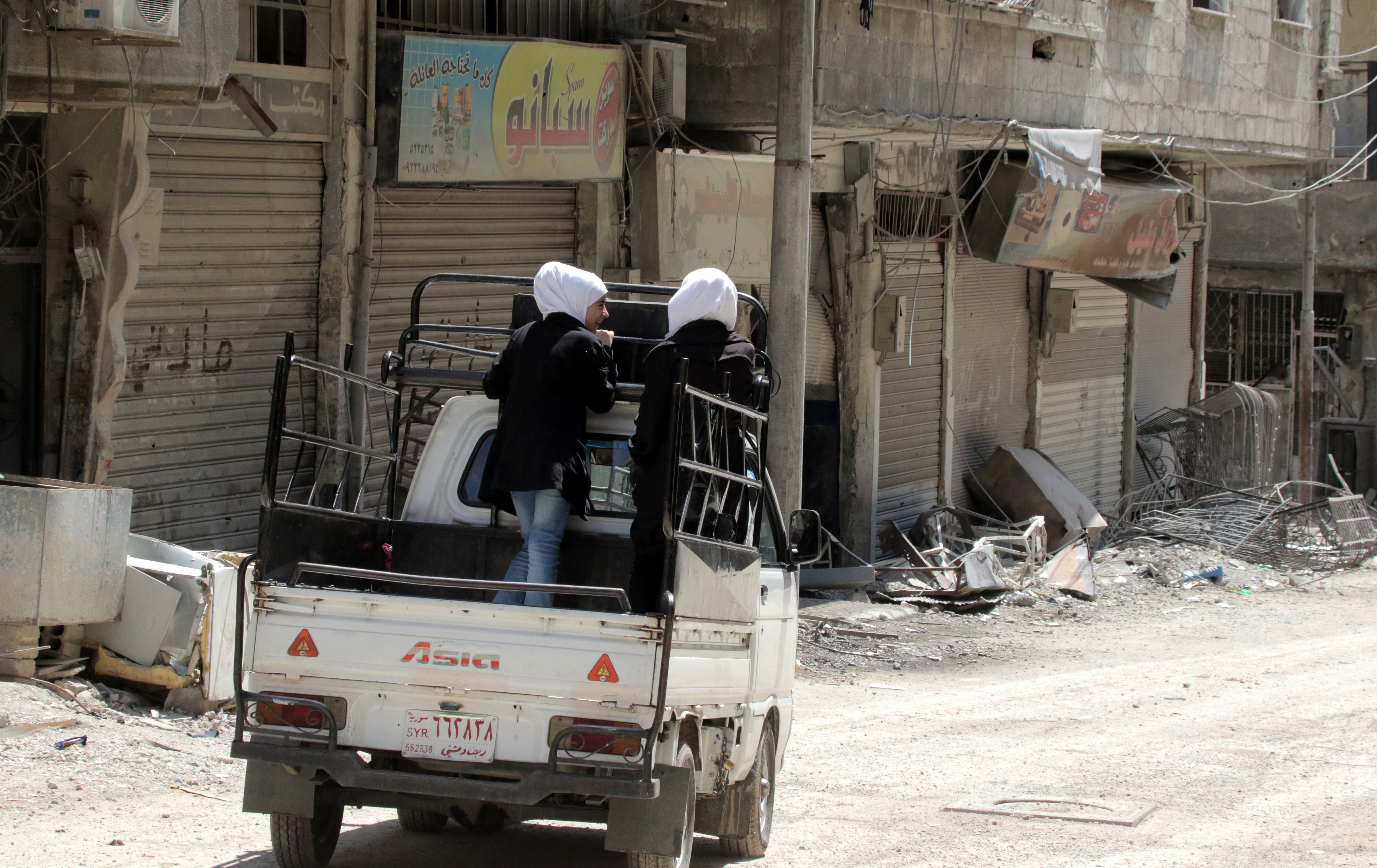 epa06661993 A car drives through the newly-captured town of Zamalka town, Eastern Ghouta, in the countryside of Damascus, Syria, 11 April 2018. The city was recently recaptured by the Syrian government during a military offensive that was launched more than a month ago against rebels. According to media reports, Syrian army seized control of scores of towns and villages in the area.  EPA/YOUSSEF BADAWI
