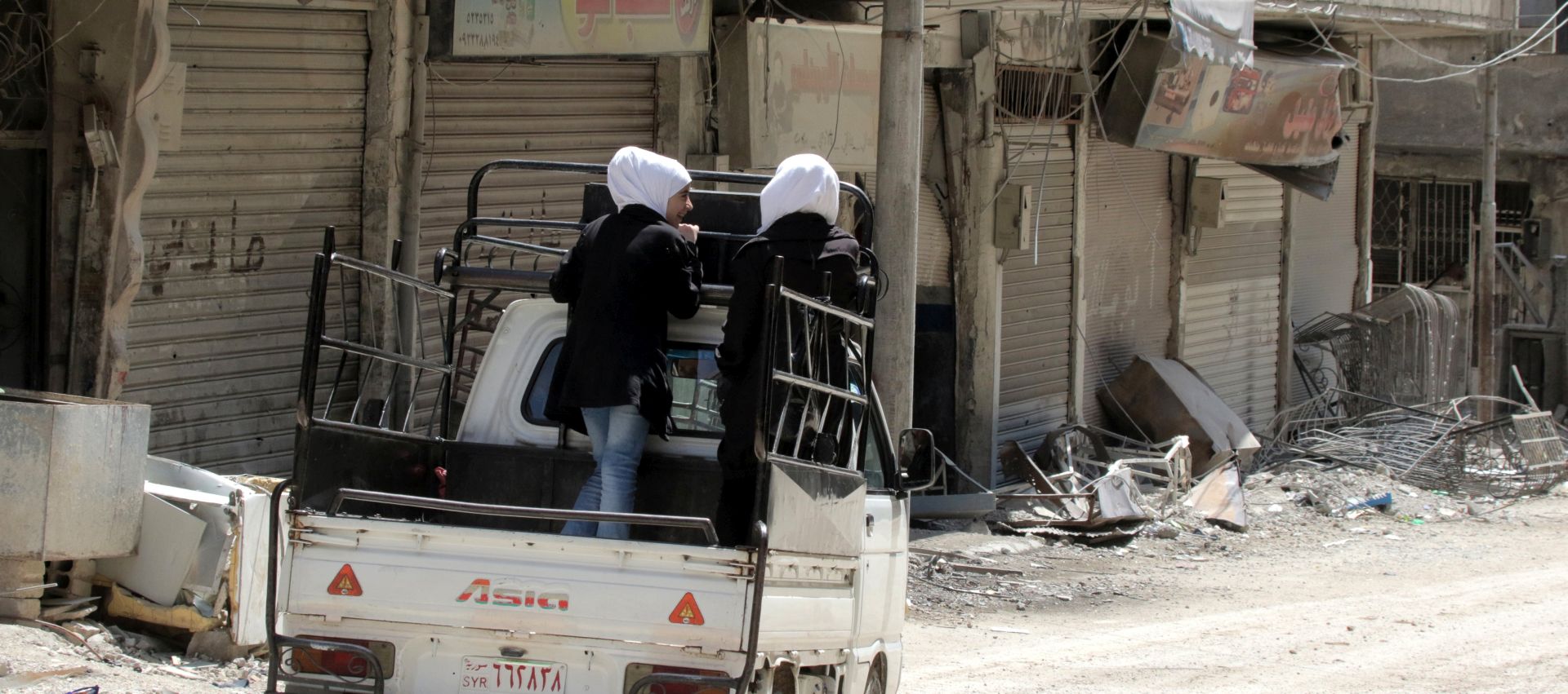 epa06661993 A car drives through the newly-captured town of Zamalka town, Eastern Ghouta, in the countryside of Damascus, Syria, 11 April 2018. The city was recently recaptured by the Syrian government during a military offensive that was launched more than a month ago against rebels. According to media reports, Syrian army seized control of scores of towns and villages in the area.  EPA/YOUSSEF BADAWI